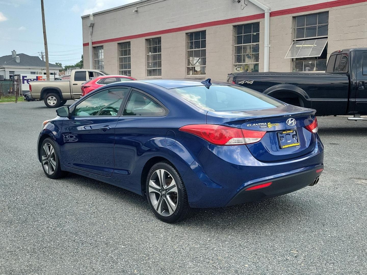 2013 Atlantic Blue - S7U /Black - RY Hyundai Elantra Coupe SE (KMHDH6AE8DU) with an 1.8L DOHC MPFI D-CVVT 16-valve I4 engine engine, located at 50 Eastern Blvd., Essex, MD, 21221, (410) 686-3444, 39.304367, -76.484947 - Introducing the 2013 Hyundai Elantra Coupe SE 2dr Auto SE PZEV, a luxurious blend of style, efficiency, and performance. This sleek model boasts an alluring Atlantic Blue exterior paired with a sophisticated black interior. Under the hood, you'll discover a powerful 1.8L DOHC MPFI D-CVVT 16-Valve I4 - Photo#3