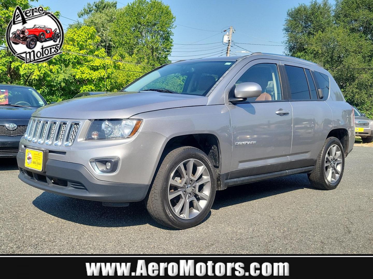 2016 Billet Silver Metallic Clearcoat - PSC /Saddle Tan/Dk Slate Gray - SLVT Jeep Compass High Altitude Edition (1C4NJDEB1GD) with an ENGINE: 2.4L I4 DOHC 16V DUAL VVT engine, located at 50 Eastern Blvd., Essex, MD, 21221, (410) 686-3444, 39.304367, -76.484947 - Presenting the sophisticated 2016 Jeep Compass High Altitude Edition. Clad in a stunning billet silver metallic clearcoat exterior, this 4WD, 4-door SUV captures attention on every journey. The interior is equally impressive, showcasing a luxurious saddle tan/dark slate gray color scheme. Under the - Photo#0