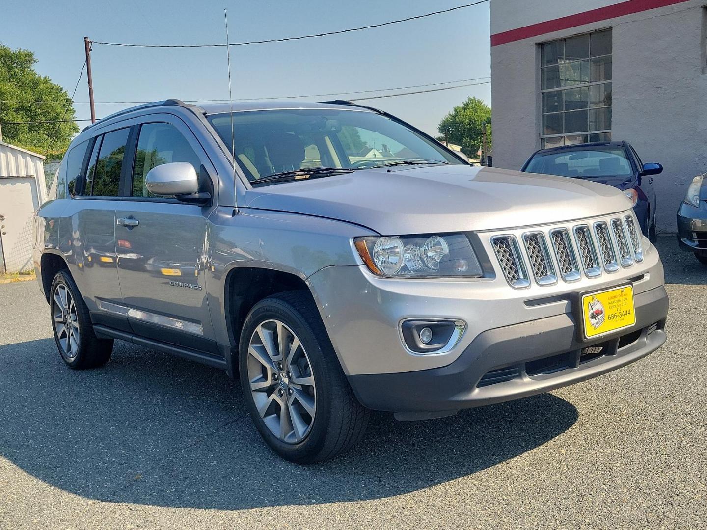 2016 Billet Silver Metallic Clearcoat - PSC /Saddle Tan/Dk Slate Gray - SLVT Jeep Compass High Altitude Edition (1C4NJDEB1GD) with an ENGINE: 2.4L I4 DOHC 16V DUAL VVT engine, located at 50 Eastern Blvd., Essex, MD, 21221, (410) 686-3444, 39.304367, -76.484947 - Presenting the sophisticated 2016 Jeep Compass High Altitude Edition. Clad in a stunning billet silver metallic clearcoat exterior, this 4WD, 4-door SUV captures attention on every journey. The interior is equally impressive, showcasing a luxurious saddle tan/dark slate gray color scheme. Under the - Photo#2