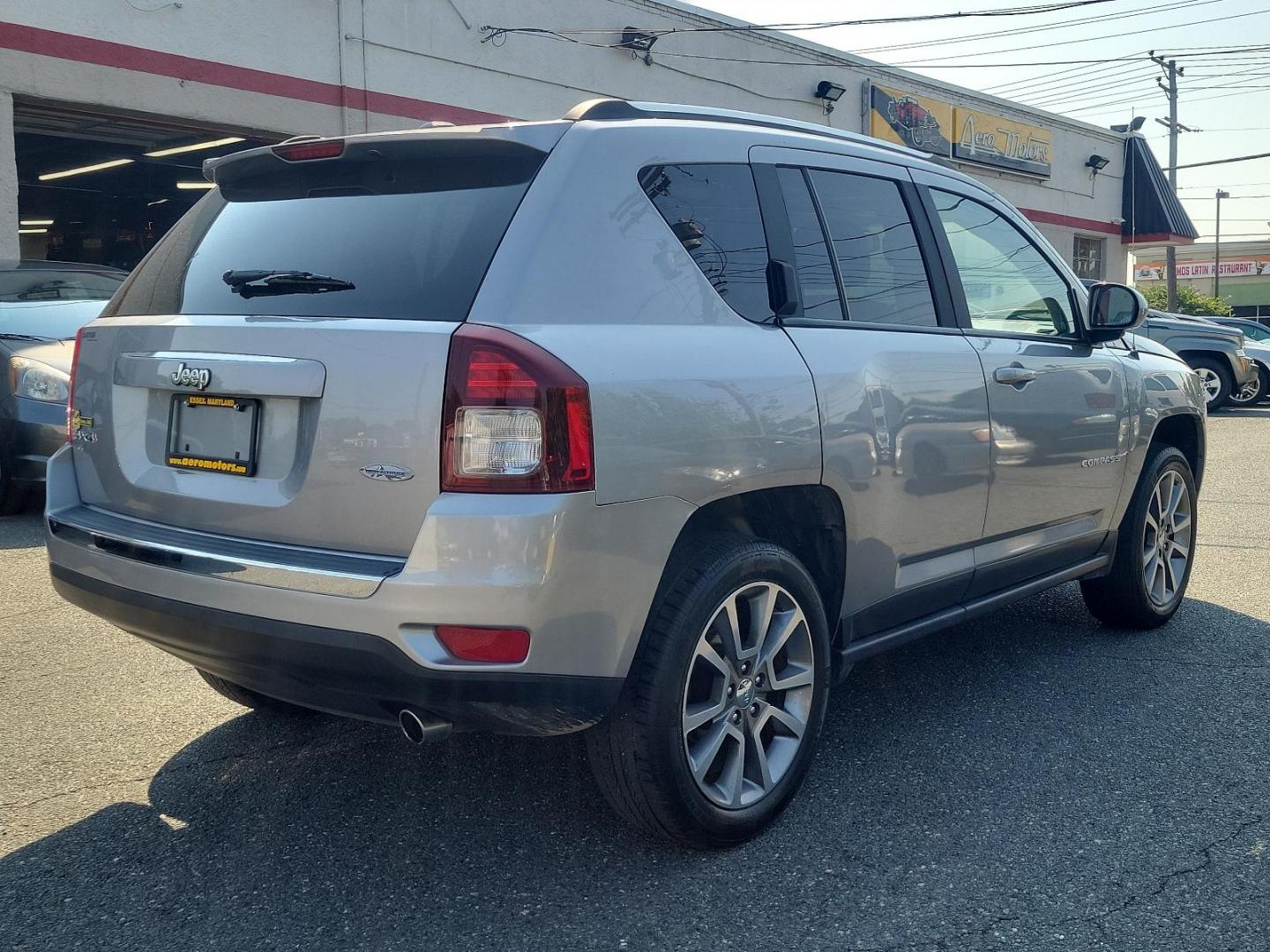 2016 Billet Silver Metallic Clearcoat - PSC /Saddle Tan/Dk Slate Gray - SLVT Jeep Compass High Altitude Edition (1C4NJDEB1GD) with an ENGINE: 2.4L I4 DOHC 16V DUAL VVT engine, located at 50 Eastern Blvd., Essex, MD, 21221, (410) 686-3444, 39.304367, -76.484947 - Presenting the sophisticated 2016 Jeep Compass High Altitude Edition. Clad in a stunning billet silver metallic clearcoat exterior, this 4WD, 4-door SUV captures attention on every journey. The interior is equally impressive, showcasing a luxurious saddle tan/dark slate gray color scheme. Under the - Photo#3