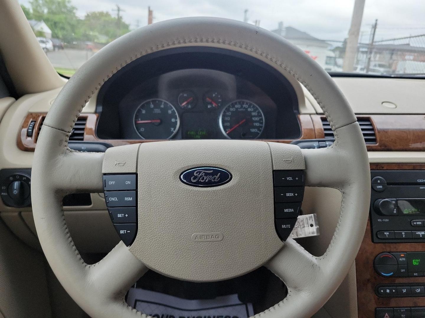 2005 Oxford White - YZ /Pebble Tan - 7 Ford Five Hundred SEL (1FAFP24175G) with an 3.0L DOHC SMPI 24-VALVE V6 DURATEC ENGINE engine, located at 50 Eastern Blvd., Essex, MD, 21221, (410) 686-3444, 39.304367, -76.484947 - Experience the perfect blend of comfort and performance with this 2005 Ford Five Hundred SEL 4dr sedan. The pristine white exterior displays a modern charm while its 3.0L DOHC SMPI 24-valve V6 Duratec engine ensures reliable performance. The Four-Door SEL model combines practicality with style, perf - Photo#16