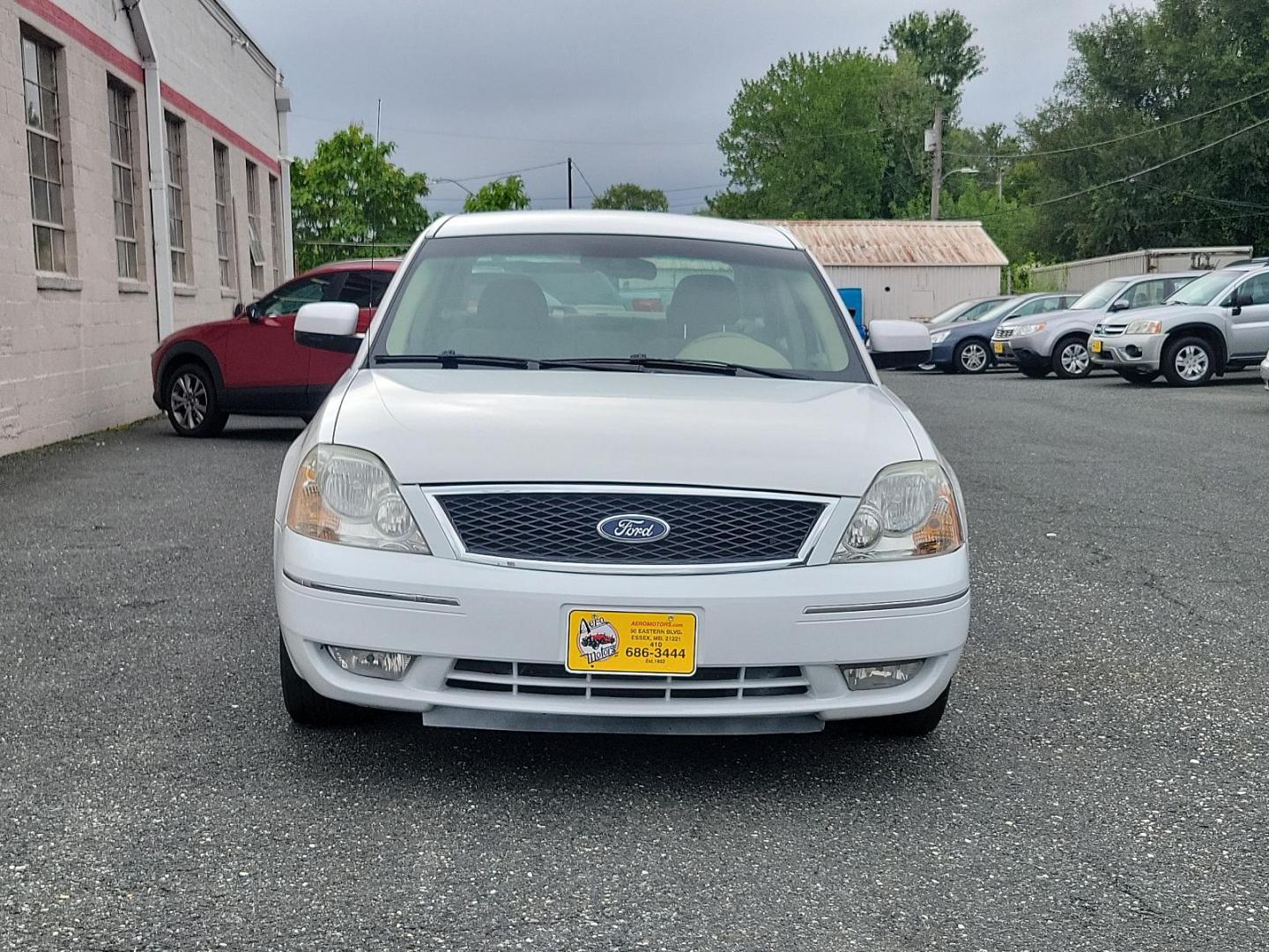 2005 Oxford White - YZ /Pebble Tan - 7 Ford Five Hundred SEL (1FAFP24175G) with an 3.0L DOHC SMPI 24-VALVE V6 DURATEC ENGINE engine, located at 50 Eastern Blvd., Essex, MD, 21221, (410) 686-3444, 39.304367, -76.484947 - Experience the perfect blend of comfort and performance with this 2005 Ford Five Hundred SEL 4dr sedan. The pristine white exterior displays a modern charm while its 3.0L DOHC SMPI 24-valve V6 Duratec engine ensures reliable performance. The Four-Door SEL model combines practicality with style, perf - Photo#1