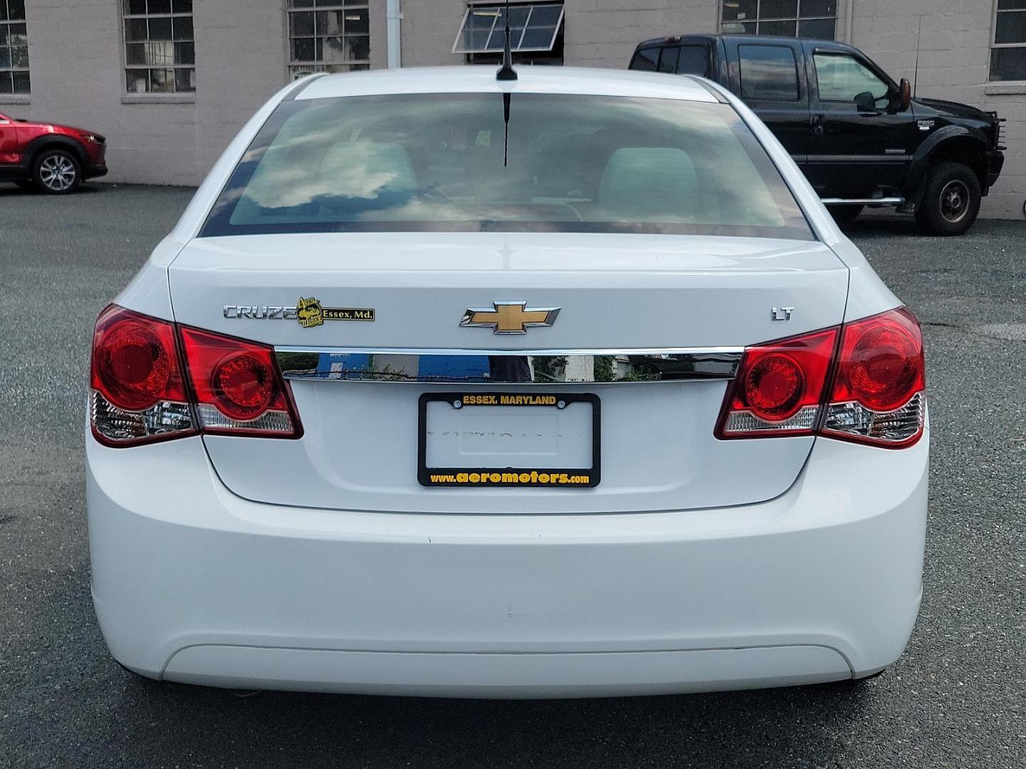 2011 Summit White - GAZ /Medium Titanium - AFC Chevrolet Cruze LT w/1LT (1G1PF5S90B7) with an ENGINE, ECOTEC TURBO 1.4L VARIABLE VALVE TIMING DOHC 4-CYLINDER SEQUENTIAL MFI, TURBO engine, located at 50 Eastern Blvd., Essex, MD, 21221, (410) 686-3444, 39.304367, -76.484947 - Experience unmatched performance and style with this 2011 Chevrolet Cruze LT w/1LT 4dr sdn lt w/1lt. Boasting a sleek summit white exterior coupled with a medium titanium interior, this vehicle exudes contemporary elegance. Under the hood, it is powered by an ecotec turbo 1.4l variable valve timing - Photo#4