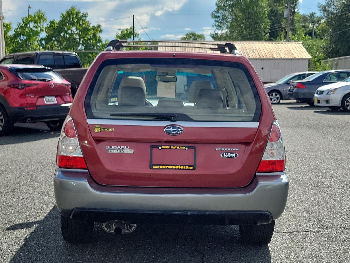 2007 Garnet Red Pearl - RE1 /Beige - BGE Subaru Forester X L.L. Bean Ed (JF1SG67637H) with an 2.5L SOHC SMPI 16-valve 4-cyl boxer engine engine, located at 50 Eastern Blvd., Essex, MD, 21221, (410) 686-3444, 39.304367, -76.484947 - Experience the fusion of class, style, and performance with this 2007 Subaru Forester X L.L. Bean Edition. Boasting a striking garnet red pearl exterior, this all-wheel-drive 4-door SUV is designed to make a statement. At the heart of this beauty lies a 2.5L SOHC SMPI 16-valve 4-cylinder boxer engin - Photo#4