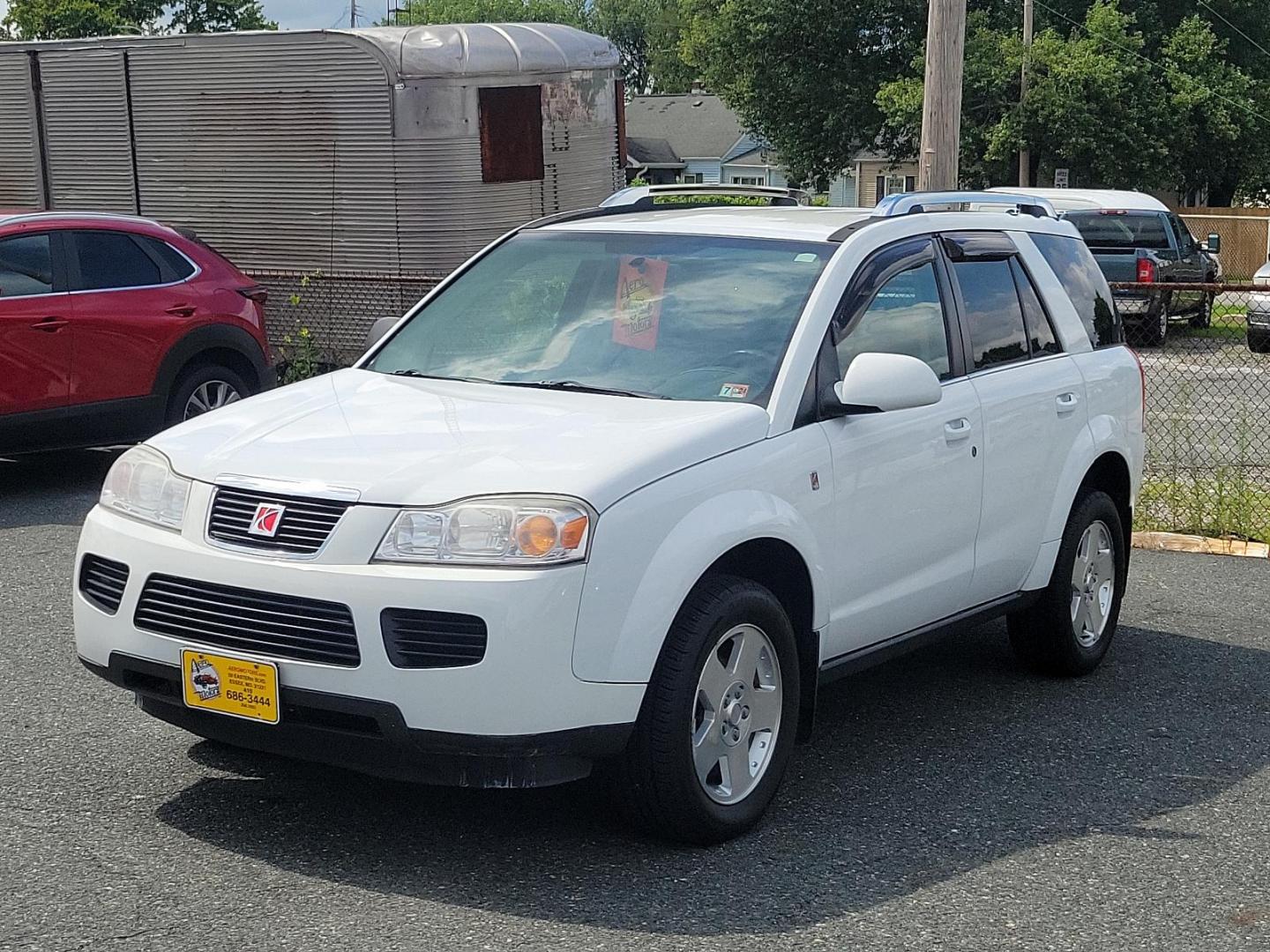 2007 Polar White - 50U /Gray - 17 Saturn VUE V6 (5GZCZ63477S) with an 3.5L SOHC MFI 24-VALVE V6 ENGINE engine, located at 50 Eastern Blvd., Essex, MD, 21221, (410) 686-3444, 39.304367, -76.484947 - Discover the elegance and comfort of the 2007 Saturn VUE V6 AWD 4dr V6 Auto. Dressed in a sophisticated Polar White exterior, this luxury SUV brings a whole new meaning to comfort and class. Its elegant Gray interior further enriches its distinctive aesthetics. Powered by a formidable 3.5L SOHC MFI - Photo#2