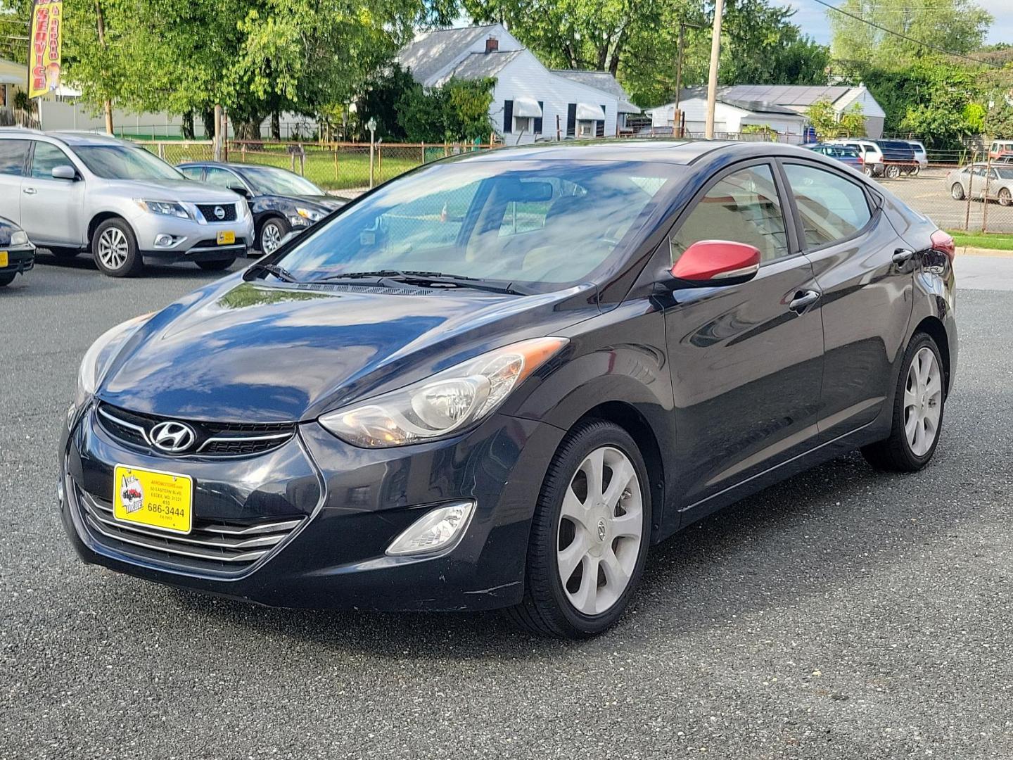 2011 Black Noir Pearl - NKA /Beige - YDA Hyundai Elantra Ltd (KMHDH4AE5BU) with an 1.8L DOHC MPFI D-CVVT 16-valve I4 engine engine, located at 50 Eastern Blvd., Essex, MD, 21221, (410) 686-3444, 39.304367, -76.484947 - Indulge in the premium driving experience offered by this 2011 Hyundai Elantra Ltd 4dr sdn auto ltd (ulsan plant), a symbol of sophisticated practicality. A captivating sight rests on its glossy Black Noir Pearl exterior that flawlessly complements its luxurious Beige interior. With its 1.8L DOHC MP - Photo#2