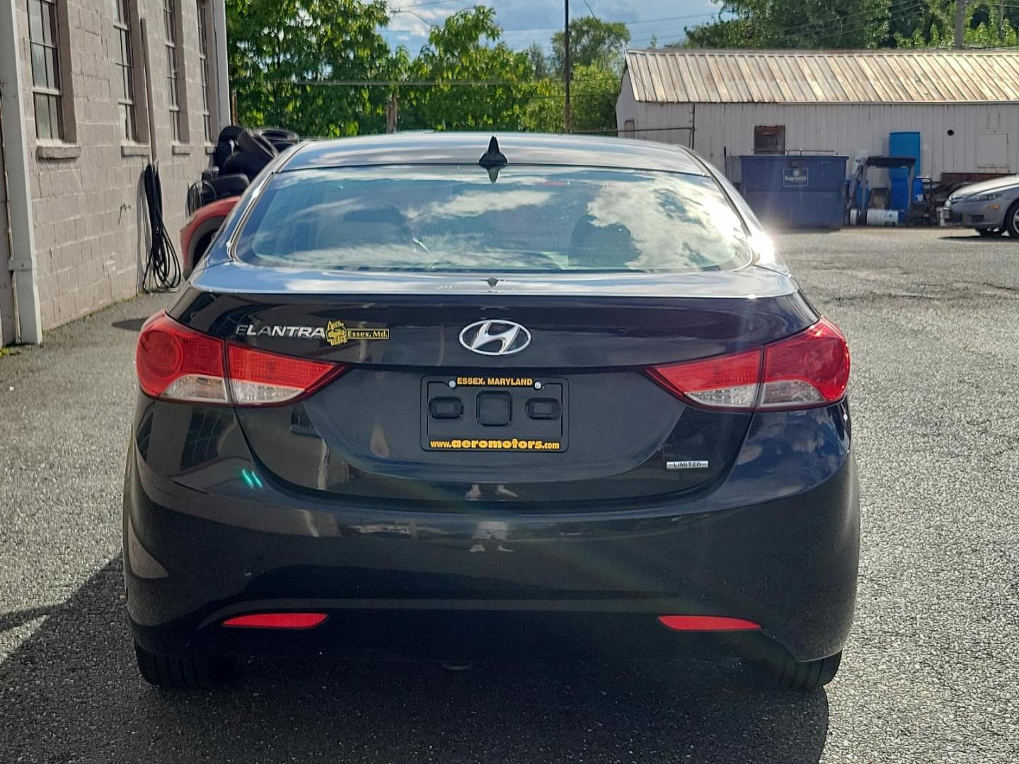 2011 Black Noir Pearl - NKA /Beige - YDA Hyundai Elantra Ltd (KMHDH4AE5BU) with an 1.8L DOHC MPFI D-CVVT 16-valve I4 engine engine, located at 50 Eastern Blvd., Essex, MD, 21221, (410) 686-3444, 39.304367, -76.484947 - Indulge in the premium driving experience offered by this 2011 Hyundai Elantra Ltd 4dr sdn auto ltd (ulsan plant), a symbol of sophisticated practicality. A captivating sight rests on its glossy Black Noir Pearl exterior that flawlessly complements its luxurious Beige interior. With its 1.8L DOHC MP - Photo#4