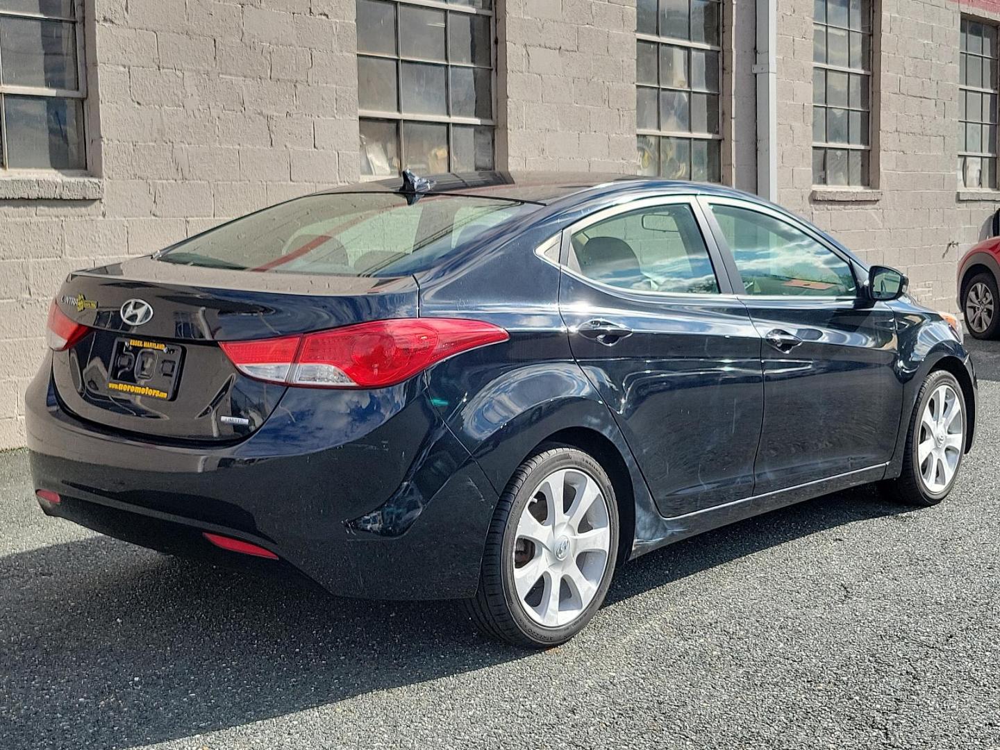 2011 Black Noir Pearl - NKA /Beige - YDA Hyundai Elantra Ltd (KMHDH4AE5BU) with an 1.8L DOHC MPFI D-CVVT 16-valve I4 engine engine, located at 50 Eastern Blvd., Essex, MD, 21221, (410) 686-3444, 39.304367, -76.484947 - Indulge in the premium driving experience offered by this 2011 Hyundai Elantra Ltd 4dr sdn auto ltd (ulsan plant), a symbol of sophisticated practicality. A captivating sight rests on its glossy Black Noir Pearl exterior that flawlessly complements its luxurious Beige interior. With its 1.8L DOHC MP - Photo#5