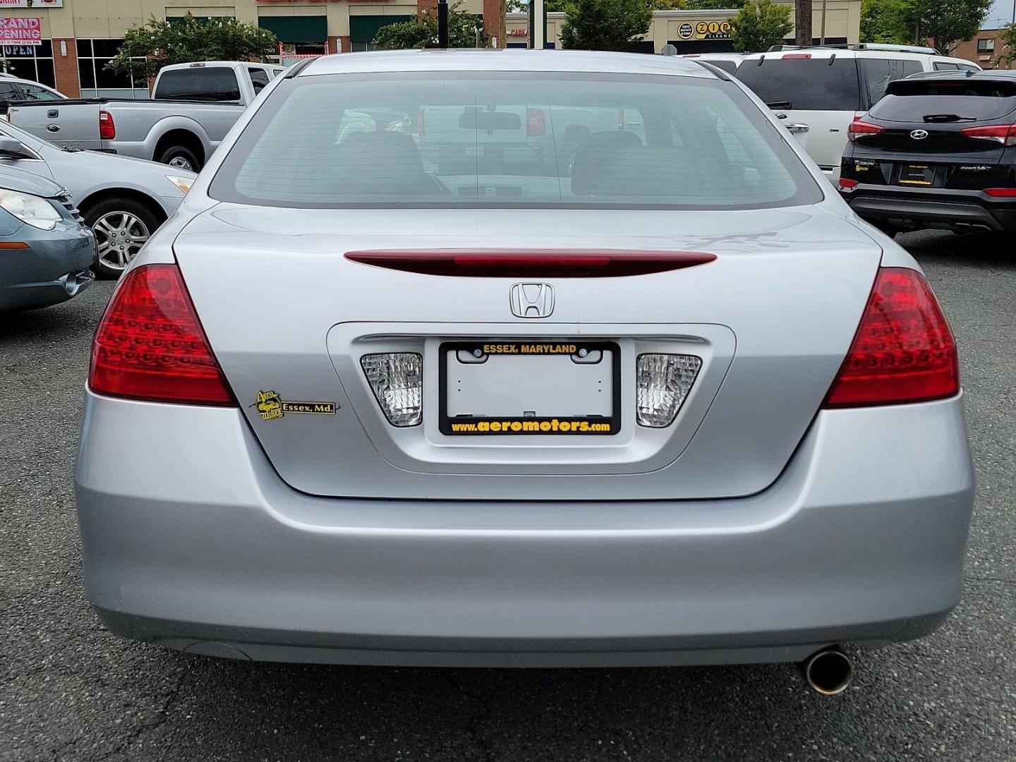 2006 Alabaster Silver Metallic - SI /Black - BK Honda Accord Sdn VP (1HGCM561X6A) with an 2.4L DOHC MPFI 16-valve i-VTEC I4 engine engine, located at 50 Eastern Blvd., Essex, MD, 21221, (410) 686-3444, 39.304367, -76.484947 - Presenting the 2006 Honda Accord Sdn VP, a blend of style, elegance and powerful performance, wrapped in a stunning grey exterior. This well-maintained mid-sized sedan comes with a robust 2.4L DOHC MPFI 16-Valve i-VTEC i4 engine that guarantees impressive on-road performance and remarkable fuel effi - Photo#4