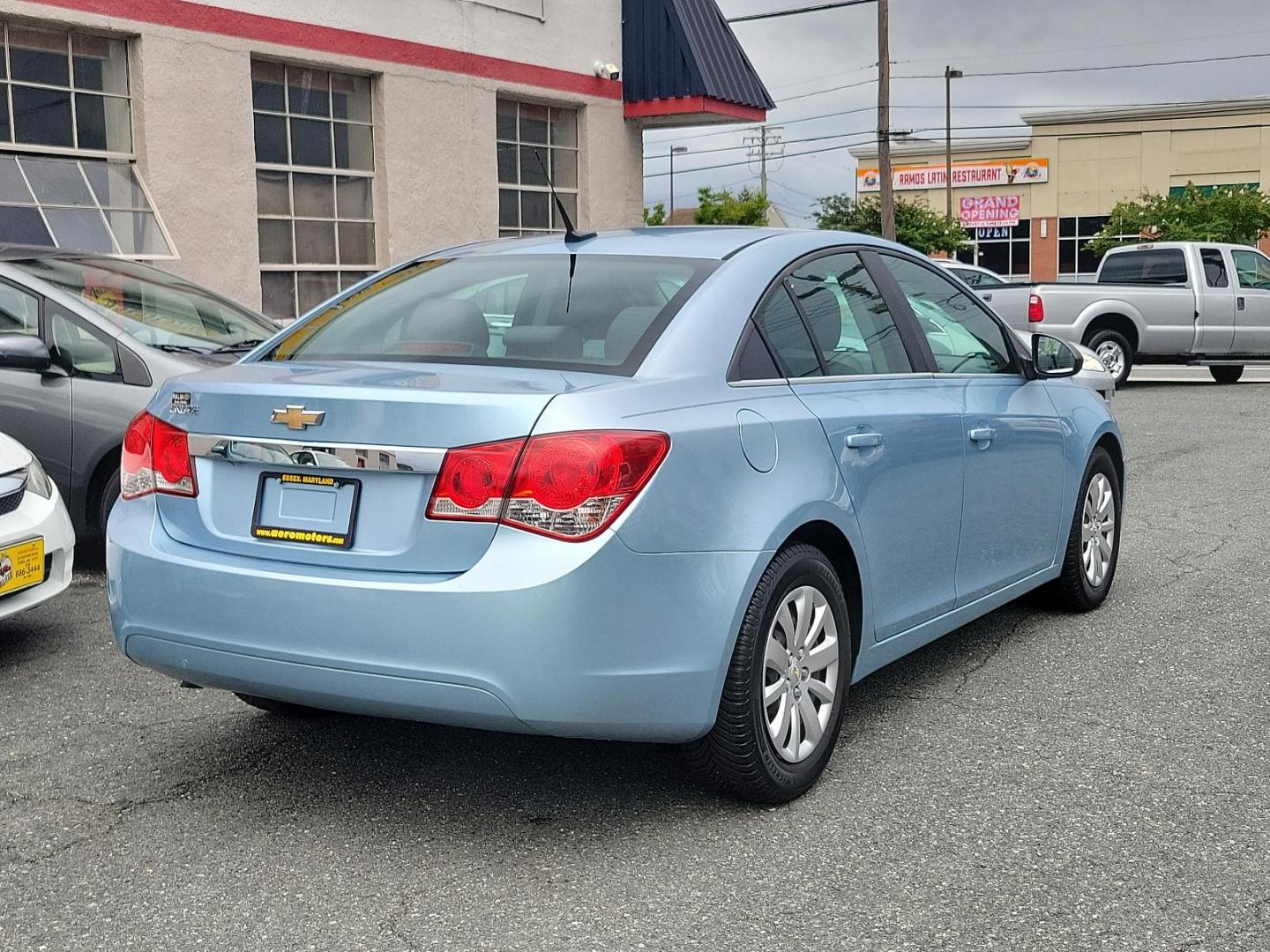 2011 Ice Blue Metallic - GLF /Jet Black/Medium Titanium - AFB Chevrolet Cruze LS (1G1PC5SH7B7) with an ENGINE, ECOTEC 1.8L VARIABLE VALVE TIMING DOHC 4-CYLINDER SEQUENTIAL MFI engine, located at 50 Eastern Blvd., Essex, MD, 21221, (410) 686-3444, 39.304367, -76.484947 - Immerse yourself in the captivating allure of this 2011 Chevrolet Cruze LS 4dr Sedan LS. Designed with a stylish Ice Blue Metallic exterior, it's sure to turn heads wherever it goes. The roomy inside, adorned with a tasteful Jet Black/Medium Titanium interior, blends sophistication and comfort to cr - Photo#5