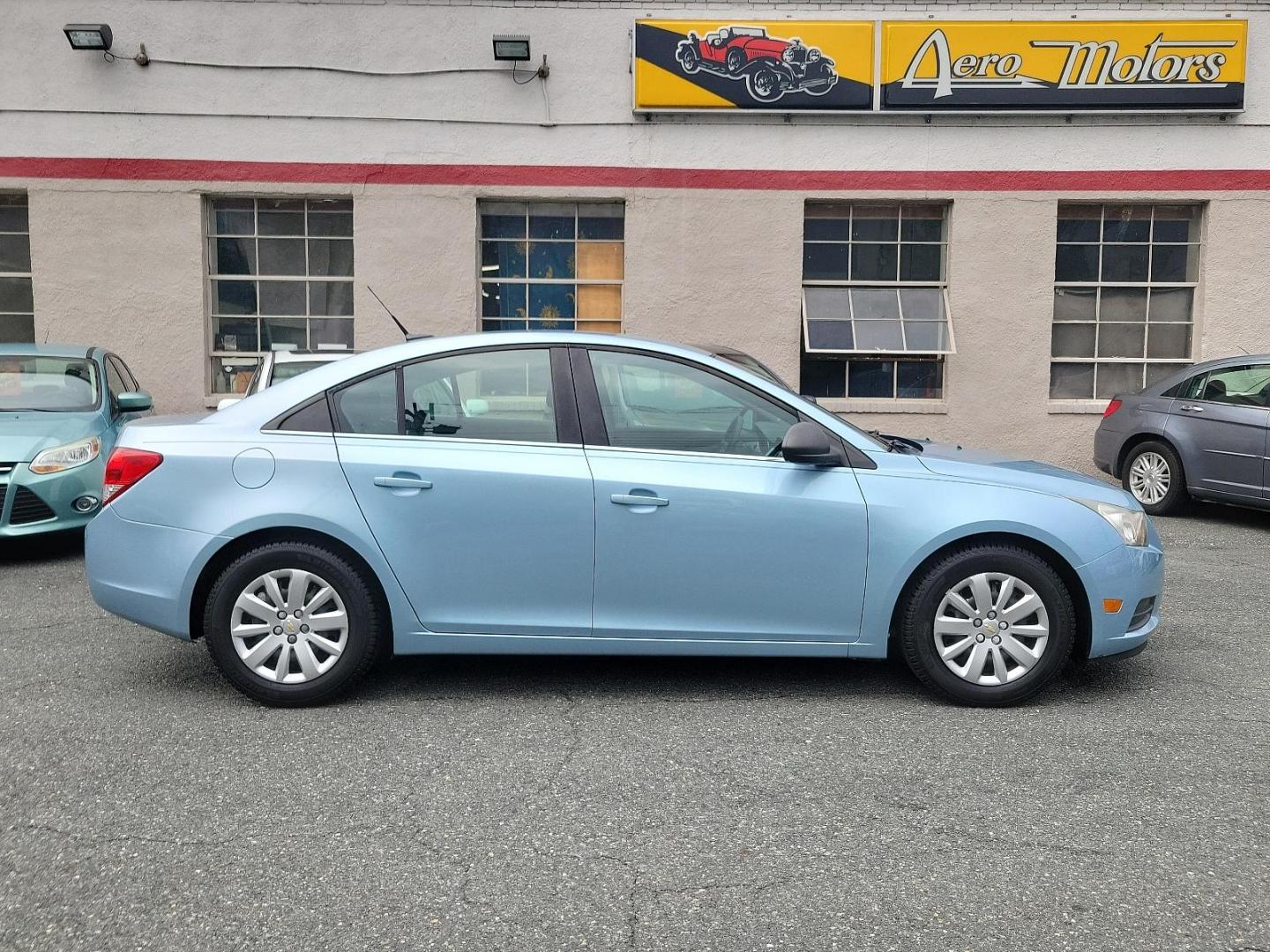 2011 Ice Blue Metallic - GLF /Jet Black/Medium Titanium - AFB Chevrolet Cruze LS (1G1PC5SH7B7) with an ENGINE, ECOTEC 1.8L VARIABLE VALVE TIMING DOHC 4-CYLINDER SEQUENTIAL MFI engine, located at 50 Eastern Blvd., Essex, MD, 21221, (410) 686-3444, 39.304367, -76.484947 - Immerse yourself in the captivating allure of this 2011 Chevrolet Cruze LS 4dr Sedan LS. Designed with a stylish Ice Blue Metallic exterior, it's sure to turn heads wherever it goes. The roomy inside, adorned with a tasteful Jet Black/Medium Titanium interior, blends sophistication and comfort to cr - Photo#6