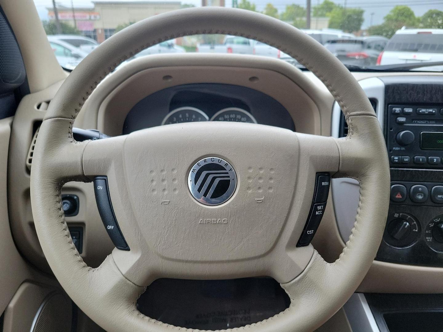 2005 Satellite Silver Metallic - T3 /Pebble/Lt Parch - H Mercury Mariner Premier (4M2CU57115D) with an 3.0L V6 "DURATEC" ENGINE engine, located at 50 Eastern Blvd., Essex, MD, 21221, (410) 686-3444, 39.304367, -76.484947 - Introducing the luxurious 2005 Mercury Mariner Premier 4dr 103" wb Premier 4WD. Displaying a sophisticated Satellite Silver Metallic - t3 exterior complemented beautifully with a classy Pebble/Lt Parch - h interior, this Mariner exemplifies elegance and style. Under the hood, you'll discover a power - Photo#14