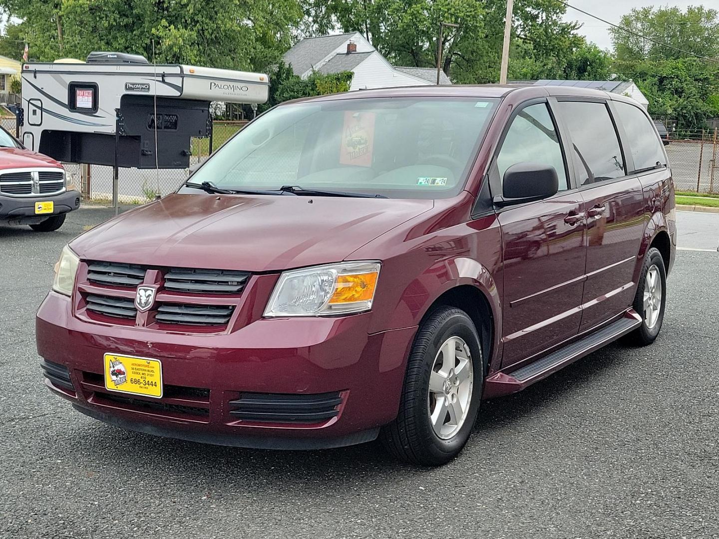 2009 Deep Crimson Crystal Pearl - PHF /Medium Slate/Light Shale - B7DS Dodge Grand Caravan SE (2D8HN44E59R) with an 3.3L OHV V6 ENGINE engine, located at 50 Eastern Blvd., Essex, MD, 21221, (410) 686-3444, 39.304367, -76.484947 - Introducing the 2009 Dodge Grand Caravan SE 4dr Wgn SE, a perfect harmony of space, comfort, and performance! Coated in a deep Crimson Crystal Pearl exterior flawlessly complementing a Medium Slate/Light Shale interior, this van offers a premium look that captures attention with every turn. Its hear - Photo#2