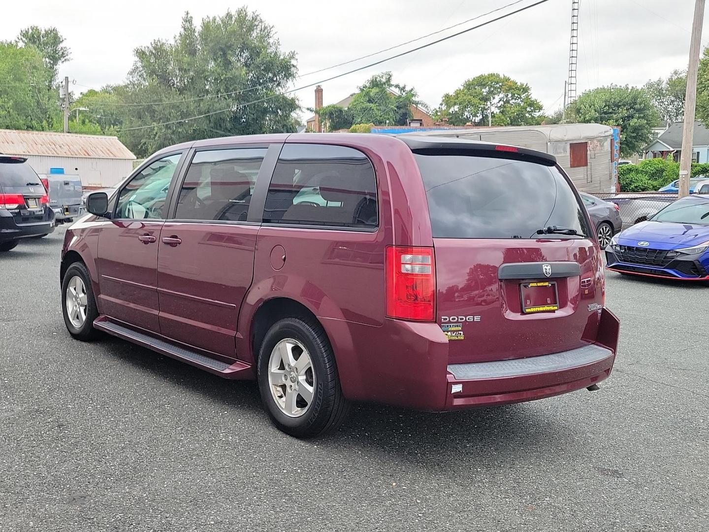 2009 Deep Crimson Crystal Pearl - PHF /Medium Slate/Light Shale - B7DS Dodge Grand Caravan SE (2D8HN44E59R) with an 3.3L OHV V6 ENGINE engine, located at 50 Eastern Blvd., Essex, MD, 21221, (410) 686-3444, 39.304367, -76.484947 - Introducing the 2009 Dodge Grand Caravan SE 4dr Wgn SE, a perfect harmony of space, comfort, and performance! Coated in a deep Crimson Crystal Pearl exterior flawlessly complementing a Medium Slate/Light Shale interior, this van offers a premium look that captures attention with every turn. Its hear - Photo#3