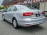 2015 Moonrock Silver Metallic - 0B0B /Titan Black - JM Volkswagen Jetta Sedan 2.0L S (3VW2K7AJ5FM) with an Engine: 2.0L I-4 SOHC engine, located at 50 Eastern Blvd., Essex, MD, 21221, (410) 686-3444, 39.304367, -76.484947 - Introducing the stunning 2015 Volkswagen Jetta Sedan 2.0L S, a refined representation of power and style. Finished in an attractive gray exterior, this 4-door vehicle is a striking combination of performance and efficiency. At its heart lies a robust 2.0L I-4 SOHC engine, offering dynamic handling a - Photo#3