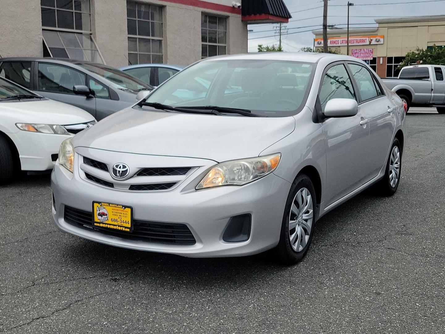 2012 Classic Silver Metallic - 1F7 /Ash - FB16 Toyota Corolla LE (2T1BU4EE1CC) with an 1.8L DOHC SFI 16-valve VVT-i I4 engine engine, located at 50 Eastern Blvd., Essex, MD, 21221, (410) 686-3444, 39.304367, -76.484947 - Introducing the sleek and dependable 2012 Toyota Corolla LE 4dr Sdn Auto LE (Natl), sporting a classic silver metallic - 1F7 exterior that accentuates its poised design. Nestled inside, the car features a clean and comfortable ash - FB16 interior, delivering a comfortable ride over any distance. Pow - Photo#2