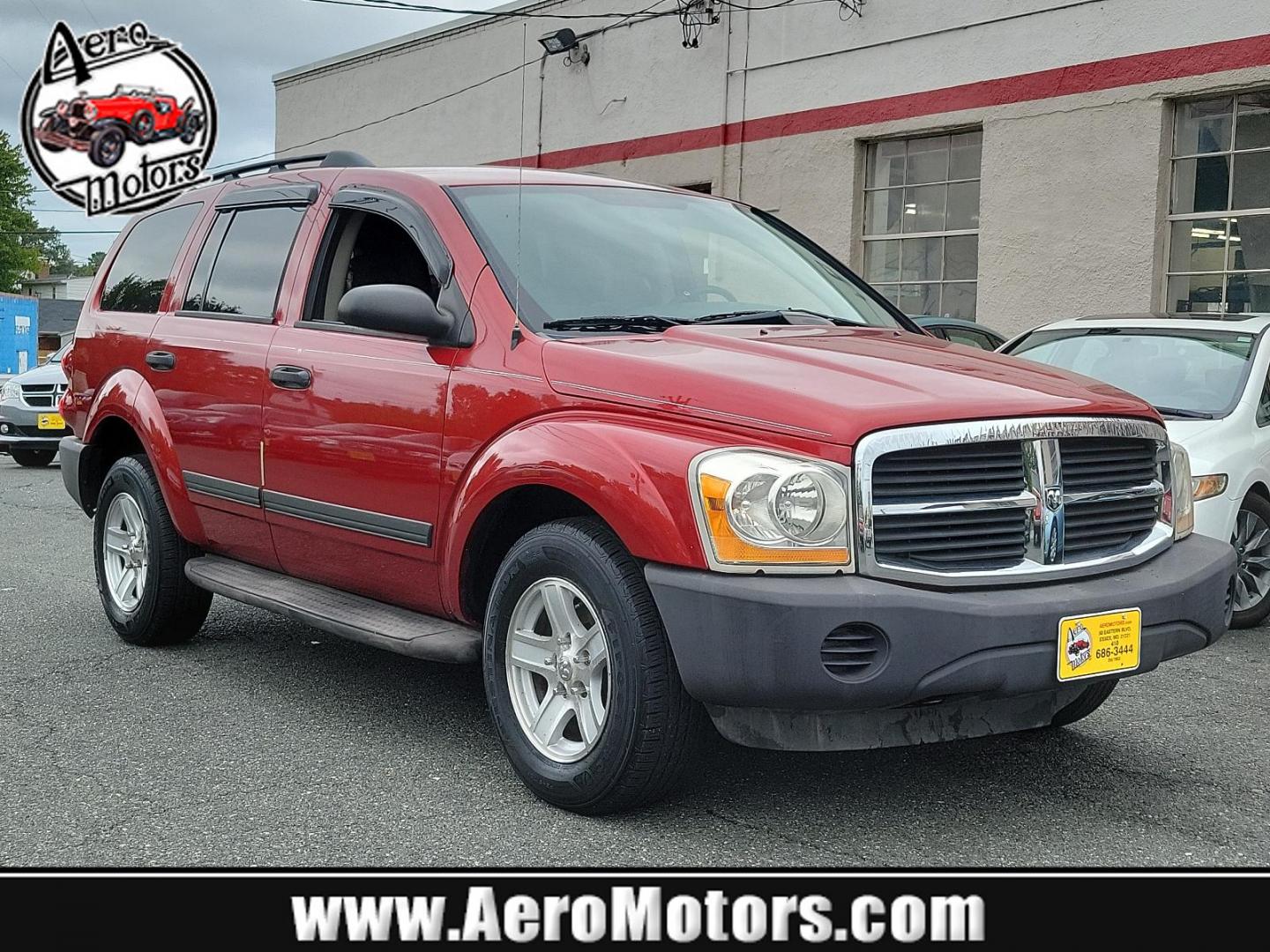 2006 Inferno Red Crystal Pearl /Med Slate Gray - D5 Dodge Durango SXT (1D4HB38N26F) with an 4.7L V8 "MAGNUM" ENGINE engine, located at 50 Eastern Blvd., Essex, MD, 21221, (410) 686-3444, 39.304367, -76.484947 - Introducing this striking 2006 Dodge Durango SXT 4dr 4WD with an impressive 4.7L V8 "Magnum" engine. Showcased in an alluring Inferno Red Crystal Pearl exterior, this robust SUV boasts a refined Medium Slate Gray interior, merging both performance and sophistication. Its powerful engine and 4WD capa - Photo#0