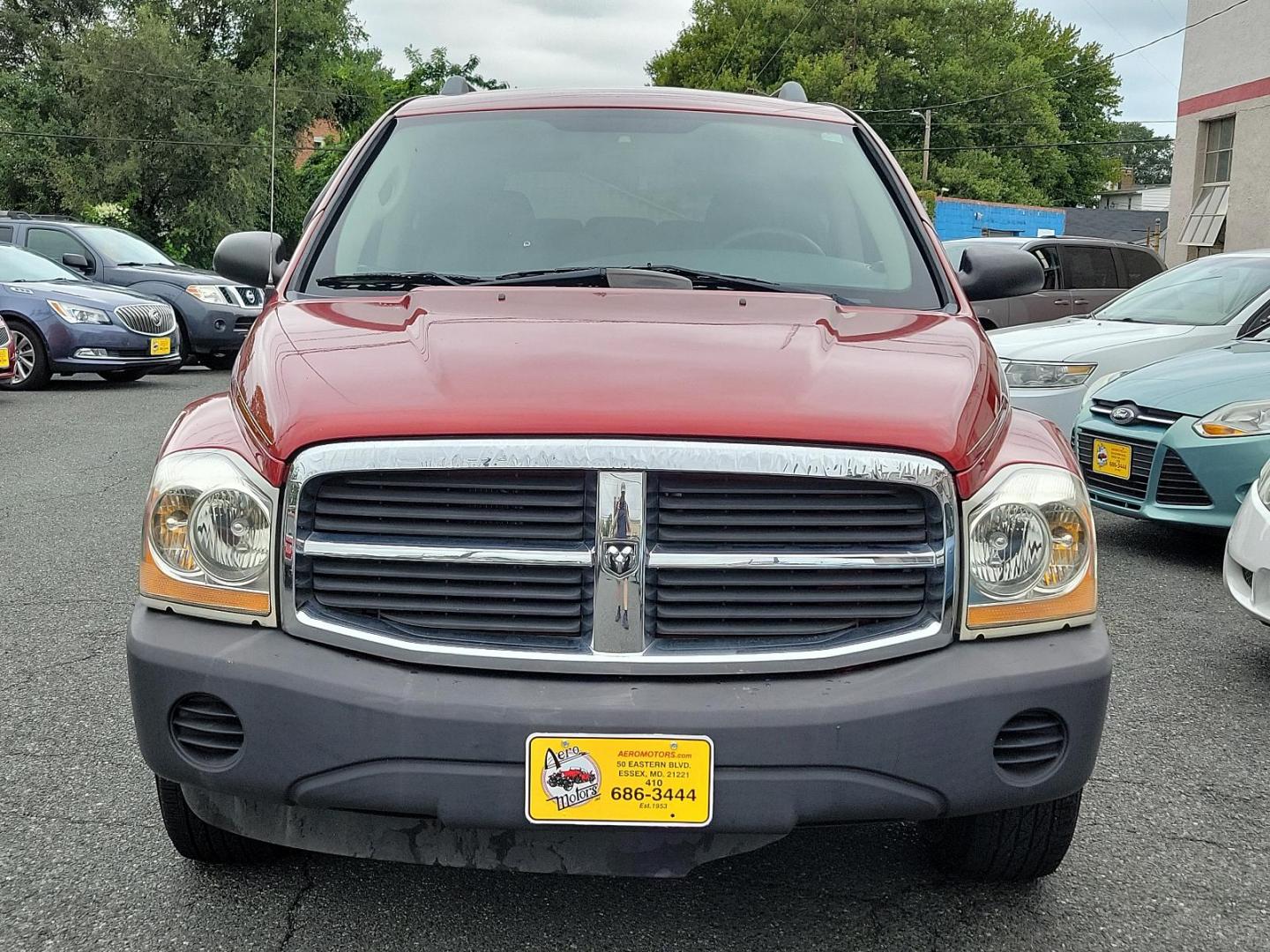 2006 Inferno Red Crystal Pearl /Med Slate Gray - D5 Dodge Durango SXT (1D4HB38N26F) with an 4.7L V8 "MAGNUM" ENGINE engine, located at 50 Eastern Blvd., Essex, MD, 21221, (410) 686-3444, 39.304367, -76.484947 - Introducing this striking 2006 Dodge Durango SXT 4dr 4WD with an impressive 4.7L V8 "Magnum" engine. Showcased in an alluring Inferno Red Crystal Pearl exterior, this robust SUV boasts a refined Medium Slate Gray interior, merging both performance and sophistication. Its powerful engine and 4WD capa - Photo#1