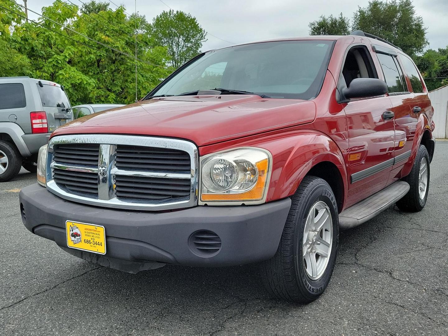 2006 Inferno Red Crystal Pearl /Med Slate Gray - D5 Dodge Durango SXT (1D4HB38N26F) with an 4.7L V8 "MAGNUM" ENGINE engine, located at 50 Eastern Blvd., Essex, MD, 21221, (410) 686-3444, 39.304367, -76.484947 - Introducing this striking 2006 Dodge Durango SXT 4dr 4WD with an impressive 4.7L V8 "Magnum" engine. Showcased in an alluring Inferno Red Crystal Pearl exterior, this robust SUV boasts a refined Medium Slate Gray interior, merging both performance and sophistication. Its powerful engine and 4WD capa - Photo#2