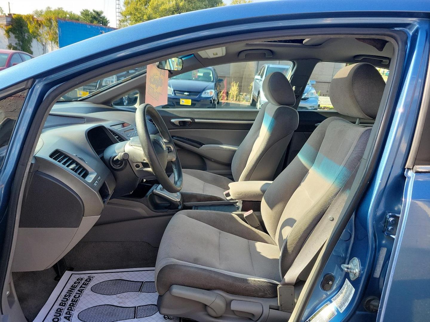 2006 Royal Blue Pearl - BL /Gray - GR Honda Civic Sdn EX (1HGFA16856L) with an 1.8L SOHC MPFI 16-valve i-VTEC I4 engine engine, located at 50 Eastern Blvd., Essex, MD, 21221, (410) 686-3444, 39.304367, -76.484947 - Featuring a 2006 Honda Civic Sdn EX ex AT draped in a stunning Royal Blue Pearl exterior and accented with a Gray interior. Equipped with a robust 1.8L SOHC MPFI 16-valve i-VTEC i4 engine, this powerhouse delivers a dynamic driving experience coupled with reliability, making each journey you embark - Photo#12