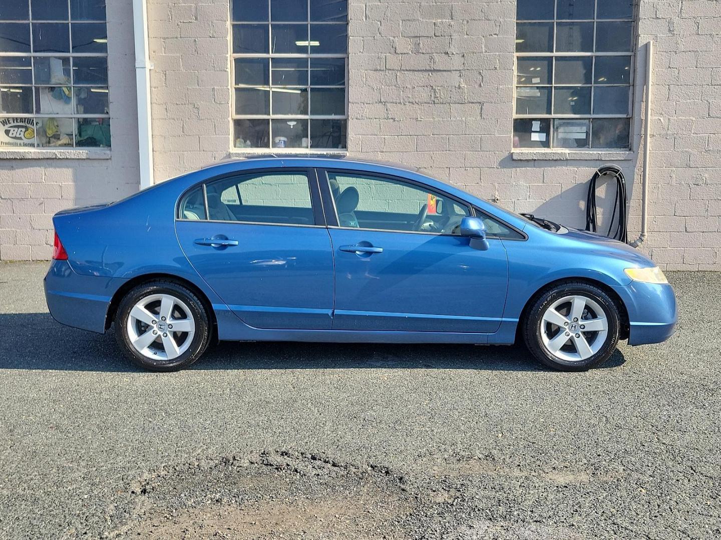 2006 Royal Blue Pearl - BL /Gray - GR Honda Civic Sdn EX (1HGFA16856L) with an 1.8L SOHC MPFI 16-valve i-VTEC I4 engine engine, located at 50 Eastern Blvd., Essex, MD, 21221, (410) 686-3444, 39.304367, -76.484947 - Featuring a 2006 Honda Civic Sdn EX ex AT draped in a stunning Royal Blue Pearl exterior and accented with a Gray interior. Equipped with a robust 1.8L SOHC MPFI 16-valve i-VTEC i4 engine, this powerhouse delivers a dynamic driving experience coupled with reliability, making each journey you embark - Photo#6