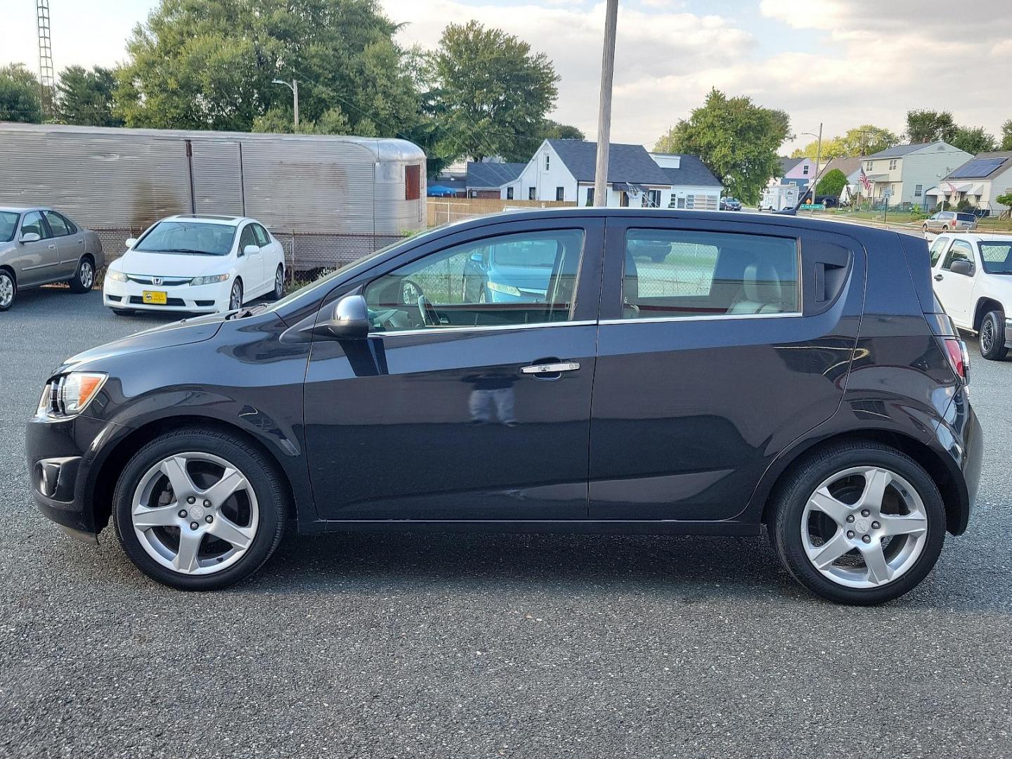 2014 Black Granite Metallic - GAR /Dark Pewter/Dark Titanium - ADP Chevrolet Sonic LTZ (1G1JE6SB3E4) with an ENGINE, ECOTEC TURBO 1.4L VARIABLE VALVE TIMING DOHC 4-CYLINDER SEQUENTIAL MFI engine, located at 50 Eastern Blvd., Essex, MD, 21221, (410) 686-3444, 39.304367, -76.484947 - Discover the outstanding 2014 Chevrolet Sonic LTZ 5-Door Hatchback Auto LTZ - an embodiment of power and style. Coated in a sleek Black Granite Metallic exterior coupled with a sophisticated Dark Pewter/Dark Titanium interior, this vehicle combines aesthetics with quality. Under the hood, nestled pe - Photo#6