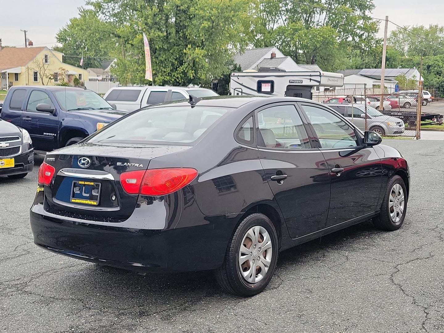 2010 Black Noir Pearl - NKA /Gray - 9Y Hyundai Elantra GLS PZEV (KMHDU4AD9AU) with an 2.0L DOHC CVVT 16-valve I4 engine engine, located at 50 Eastern Blvd., Essex, MD, 21221, (410) 686-3444, 39.304367, -76.484947 - Presenting a splendid 2010 Hyundai Elantra GLS PZEV 4dr Sdn auto GLS PZEV, a sleek, compact sedan that perfectly balances style and practicality. Coated in a captivating Black Noir Pearl exterior, this car is a sophisticated aesthetic statement on wheels. The contemporary gray interior wonderfully c - Photo#3