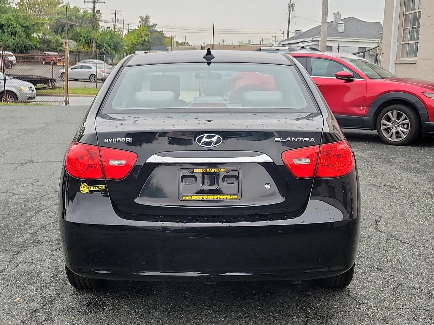 2010 Black Noir Pearl - NKA /Gray - 9Y Hyundai Elantra GLS PZEV (KMHDU4AD9AU) with an 2.0L DOHC CVVT 16-valve I4 engine engine, located at 50 Eastern Blvd., Essex, MD, 21221, (410) 686-3444, 39.304367, -76.484947 - Presenting a splendid 2010 Hyundai Elantra GLS PZEV 4dr Sdn auto GLS PZEV, a sleek, compact sedan that perfectly balances style and practicality. Coated in a captivating Black Noir Pearl exterior, this car is a sophisticated aesthetic statement on wheels. The contemporary gray interior wonderfully c - Photo#4