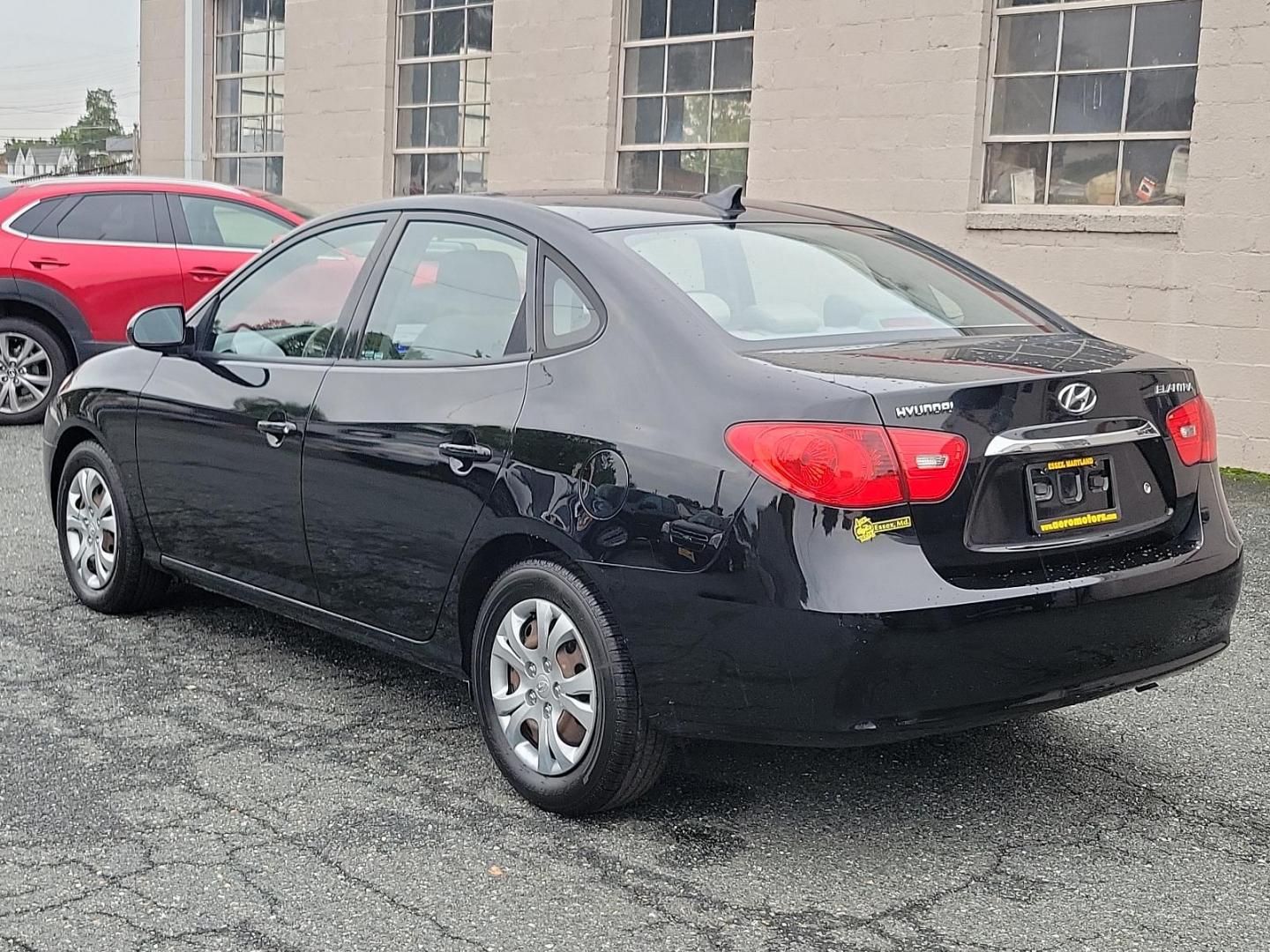 2010 Black Noir Pearl - NKA /Gray - 9Y Hyundai Elantra GLS PZEV (KMHDU4AD9AU) with an 2.0L DOHC CVVT 16-valve I4 engine engine, located at 50 Eastern Blvd., Essex, MD, 21221, (410) 686-3444, 39.304367, -76.484947 - Presenting a splendid 2010 Hyundai Elantra GLS PZEV 4dr Sdn auto GLS PZEV, a sleek, compact sedan that perfectly balances style and practicality. Coated in a captivating Black Noir Pearl exterior, this car is a sophisticated aesthetic statement on wheels. The contemporary gray interior wonderfully c - Photo#5