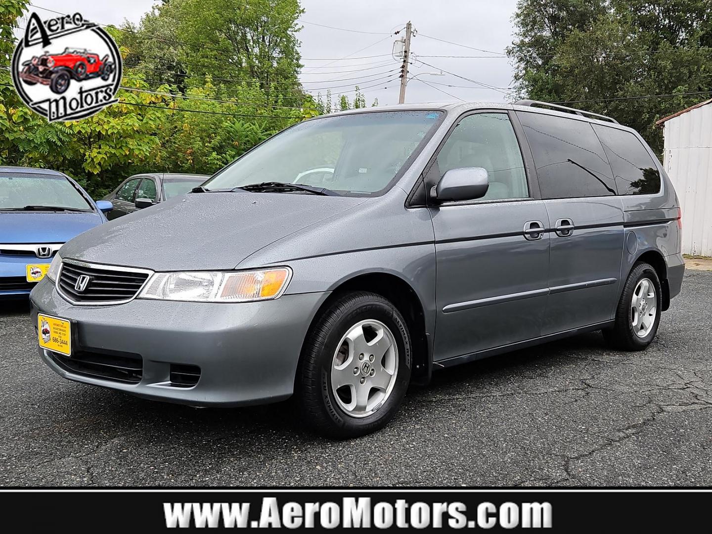 2001 Dark Emerald Pearl - /Quartz - Honda Odyssey EX (2HKRL18681H) with an 3.5L SOHC MPFI 24-valve VTEC V6 engine engine, located at 50 Eastern Blvd., Essex, MD, 21221, (410) 686-3444, 39.304367, -76.484947 - Introducing the 2001 Honda Odyssey EX, a sleek and versatile 7-passenger minivan covered in a unique and attractive green exterior that turns heads on the street. Underneath the hood lies a robust 3.5L SOHC MPFI 24-valve VTEC V6 engine, offering a balanced blend of power and efficiency. The Odyssey - Photo#0