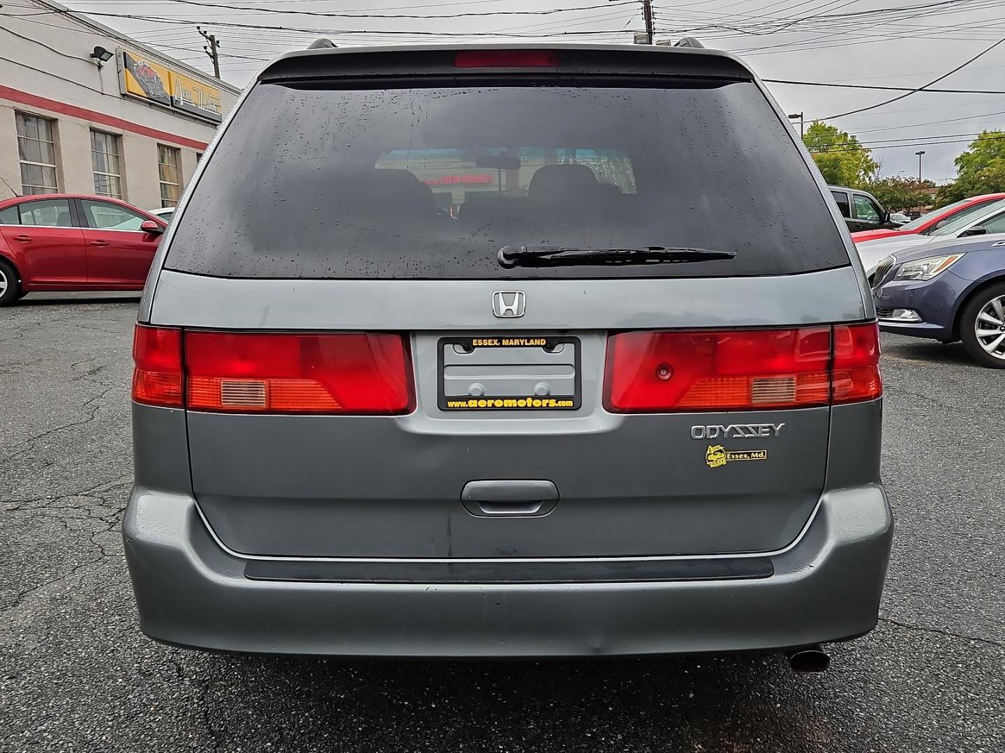 2001 Dark Emerald Pearl - /Quartz - Honda Odyssey EX (2HKRL18681H) with an 3.5L SOHC MPFI 24-valve VTEC V6 engine engine, located at 50 Eastern Blvd., Essex, MD, 21221, (410) 686-3444, 39.304367, -76.484947 - Introducing the 2001 Honda Odyssey EX, a sleek and versatile 7-passenger minivan covered in a unique and attractive green exterior that turns heads on the street. Underneath the hood lies a robust 3.5L SOHC MPFI 24-valve VTEC V6 engine, offering a balanced blend of power and efficiency. The Odyssey - Photo#4