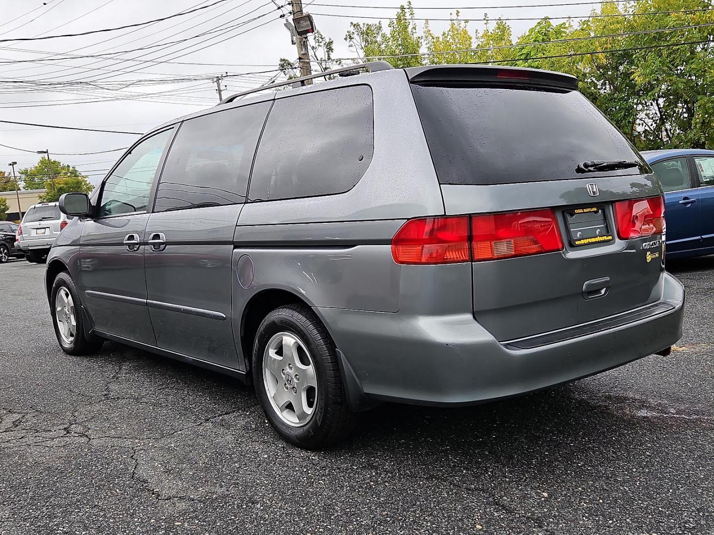 2001 Dark Emerald Pearl - /Quartz - Honda Odyssey EX (2HKRL18681H) with an 3.5L SOHC MPFI 24-valve VTEC V6 engine engine, located at 50 Eastern Blvd., Essex, MD, 21221, (410) 686-3444, 39.304367, -76.484947 - Introducing the 2001 Honda Odyssey EX, a sleek and versatile 7-passenger minivan covered in a unique and attractive green exterior that turns heads on the street. Underneath the hood lies a robust 3.5L SOHC MPFI 24-valve VTEC V6 engine, offering a balanced blend of power and efficiency. The Odyssey - Photo#5