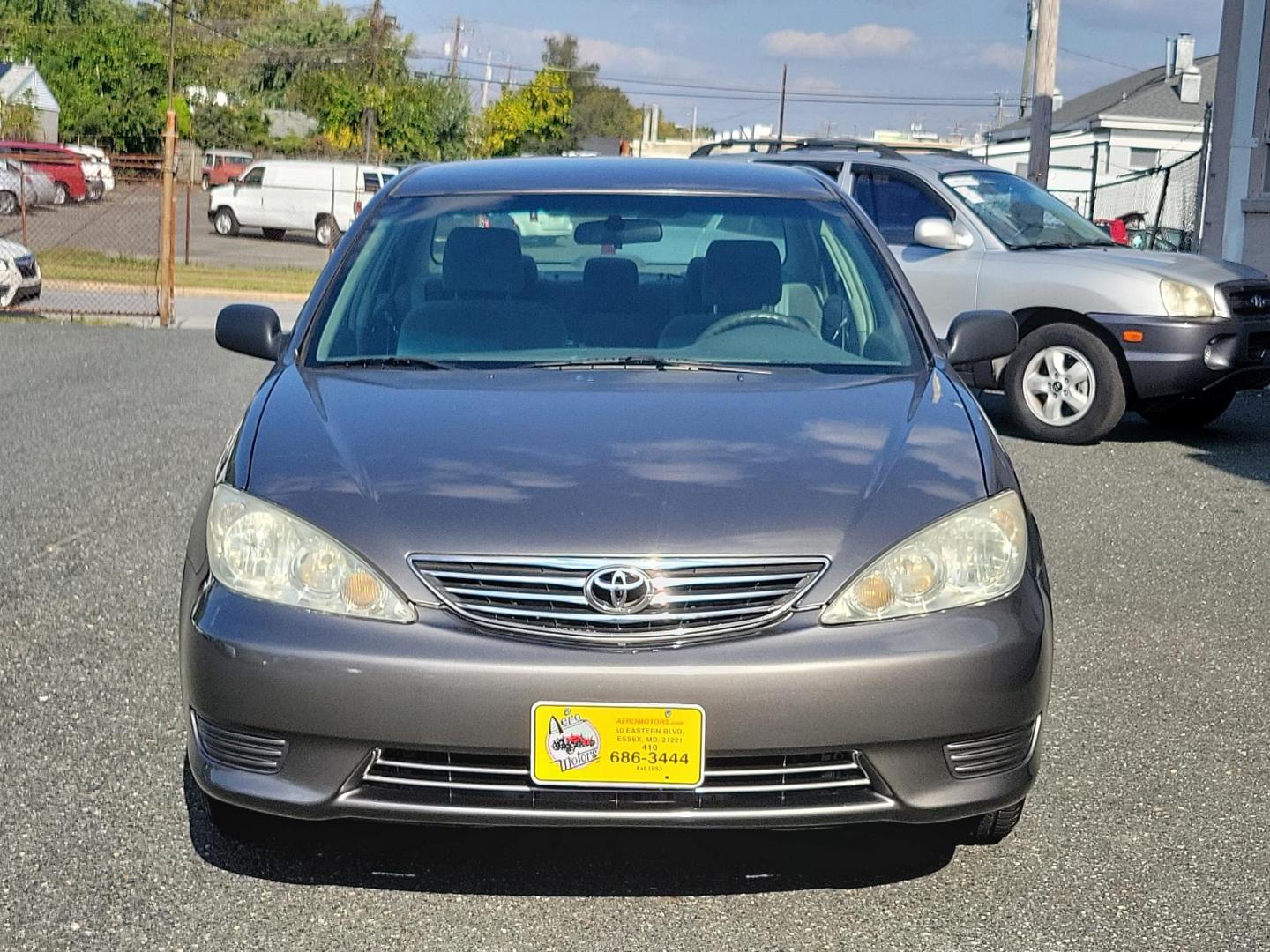 2006 Phantom Gray Pearl - 1E3 /Stone - 95 Toyota Camry LE (4T1BE32K86U) with an 2.4L DOHC SEFI 16-valve 4-cyl engine w/VVT-i engine, located at 50 Eastern Blvd., Essex, MD, 21221, (410) 686-3444, 39.304367, -76.484947 - Experience the perfect blend of efficiency and reliability with this 2006 Toyota Camry LE. Cloaked in a sleek Phantom Gray Pearl exterior, this sedan offers a spacious interior dressed in Stone - 95 hues, exuding style and comfort simultaneously. Under the hood, a hardy 2.4L DOHC SEFI 16-valve 4-Cyl - Photo#1