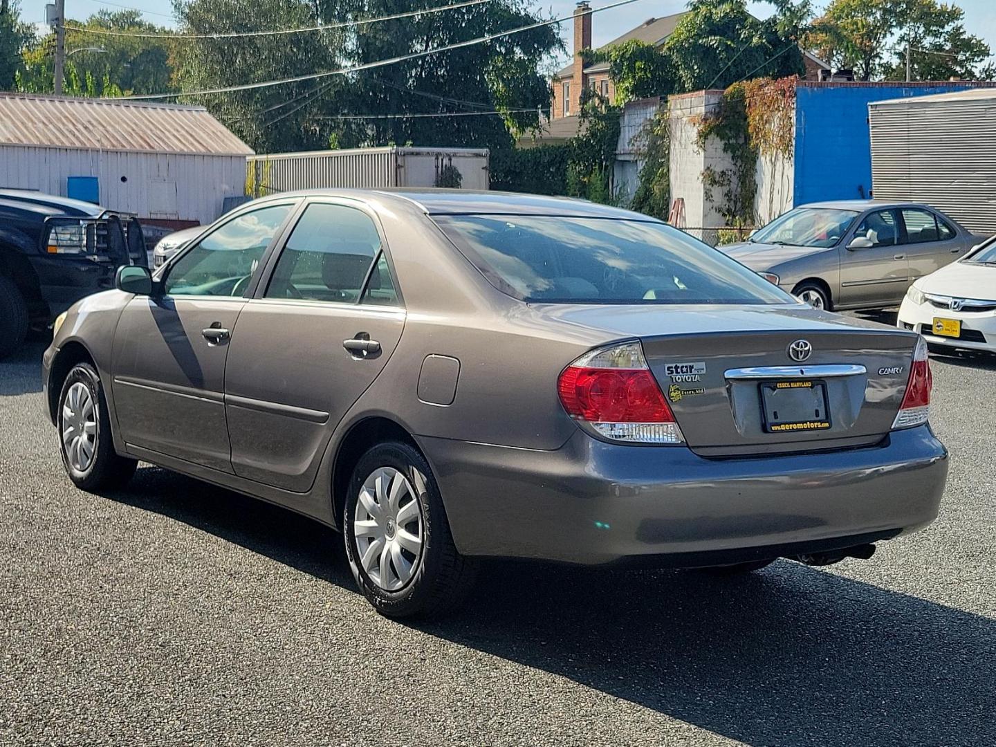 2006 Phantom Gray Pearl - 1E3 /Stone - 95 Toyota Camry LE (4T1BE32K86U) with an 2.4L DOHC SEFI 16-valve 4-cyl engine w/VVT-i engine, located at 50 Eastern Blvd., Essex, MD, 21221, (410) 686-3444, 39.304367, -76.484947 - Experience the perfect blend of efficiency and reliability with this 2006 Toyota Camry LE. Cloaked in a sleek Phantom Gray Pearl exterior, this sedan offers a spacious interior dressed in Stone - 95 hues, exuding style and comfort simultaneously. Under the hood, a hardy 2.4L DOHC SEFI 16-valve 4-Cyl - Photo#5