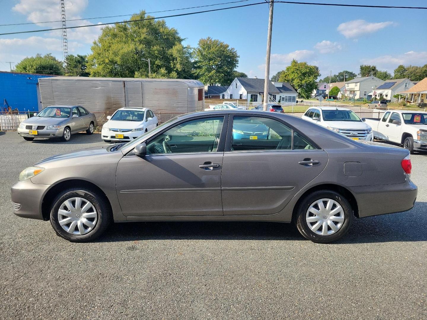 2006 Phantom Gray Pearl - 1E3 /Stone - 95 Toyota Camry LE (4T1BE32K86U) with an 2.4L DOHC SEFI 16-valve 4-cyl engine w/VVT-i engine, located at 50 Eastern Blvd., Essex, MD, 21221, (410) 686-3444, 39.304367, -76.484947 - Experience the perfect blend of efficiency and reliability with this 2006 Toyota Camry LE. Cloaked in a sleek Phantom Gray Pearl exterior, this sedan offers a spacious interior dressed in Stone - 95 hues, exuding style and comfort simultaneously. Under the hood, a hardy 2.4L DOHC SEFI 16-valve 4-Cyl - Photo#6