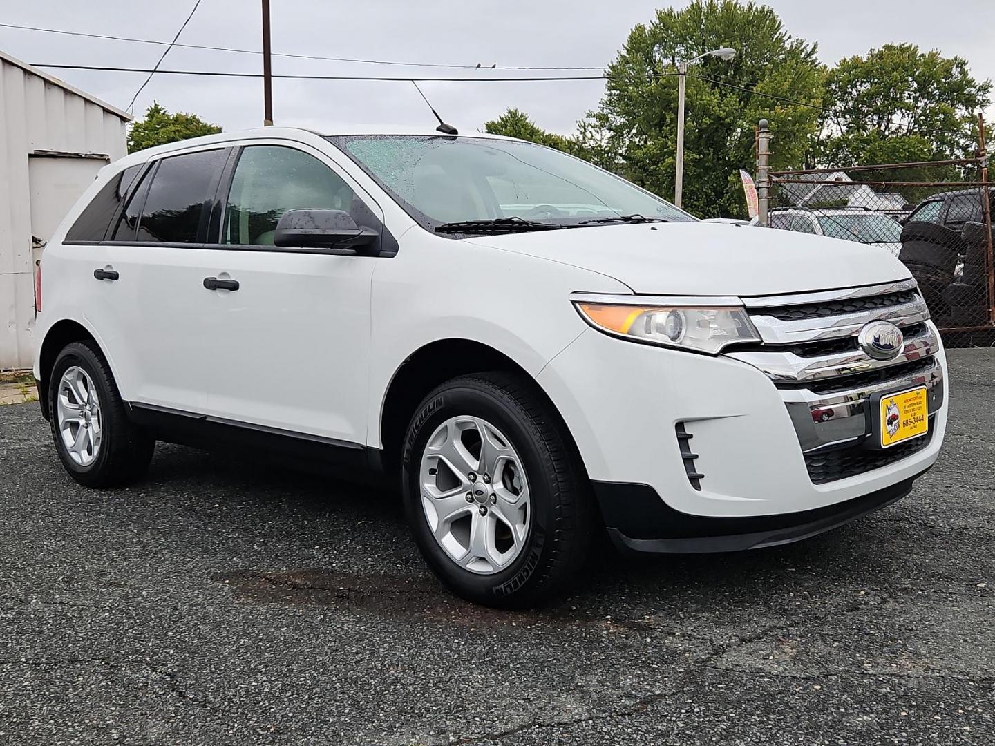 2014 Oxford White - YZ /Medium Light Stone - EL Ford Edge SE (2FMDK4GC8EB) with an ENGINE: 3.5L TI-VCT V6 engine, located at 50 Eastern Blvd., Essex, MD, 21221, (410) 686-3444, 39.304367, -76.484947 - Experience the pinnacle of practicality and performance with our 2014 Ford Edge SE 4dr AWD, adorned with a sleek white exterior. This robust SUV boasts a potent 3.5L Ti-VCT V6 engine - legendary for its reliability, smooth handling, and impressive power. The intelligent all-wheel drive system delive - Photo#2