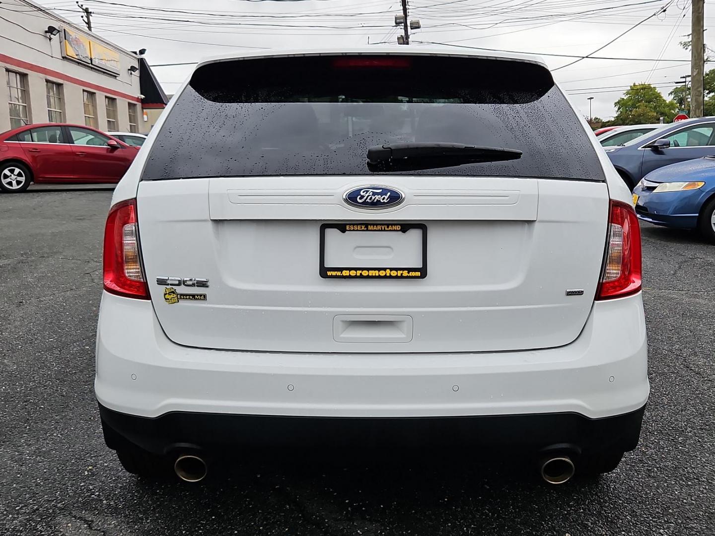 2014 Oxford White - YZ /Medium Light Stone - EL Ford Edge SE (2FMDK4GC8EB) with an ENGINE: 3.5L TI-VCT V6 engine, located at 50 Eastern Blvd., Essex, MD, 21221, (410) 686-3444, 39.304367, -76.484947 - Experience the pinnacle of practicality and performance with our 2014 Ford Edge SE 4dr AWD, adorned with a sleek white exterior. This robust SUV boasts a potent 3.5L Ti-VCT V6 engine - legendary for its reliability, smooth handling, and impressive power. The intelligent all-wheel drive system delive - Photo#4