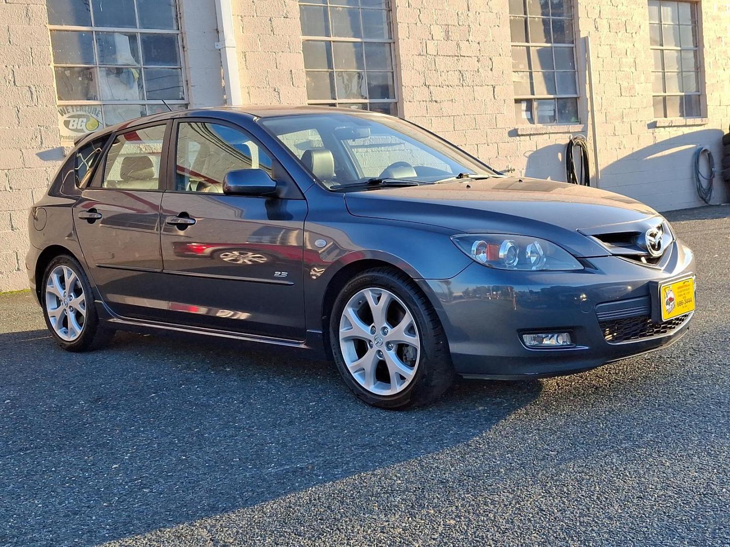 2009 Metropolitan Gray Mica - 36C /Black - BR6 Mazda MAZDA3 s Grand Touring (JM1BK343191) with an 2.3L DOHC MPFI 16-valve I4 engine w/variable valve timing (VVT), balance shafts engine, located at 50 Eastern Blvd., Essex, MD, 21221, (410) 686-3444, 39.304367, -76.484947 - Feast your eyes on this well-maintained 2009 Mazda MAZDA3 s Grand Touring, an epitome of design and functionality. This 5-door hatchback comes with an elegant metropolitan gray mica exterior complemented by a plush black interior. Under the hood, it boasts a powerful, sophisticated 2.3L DOHC MPFI 16 - Photo#2