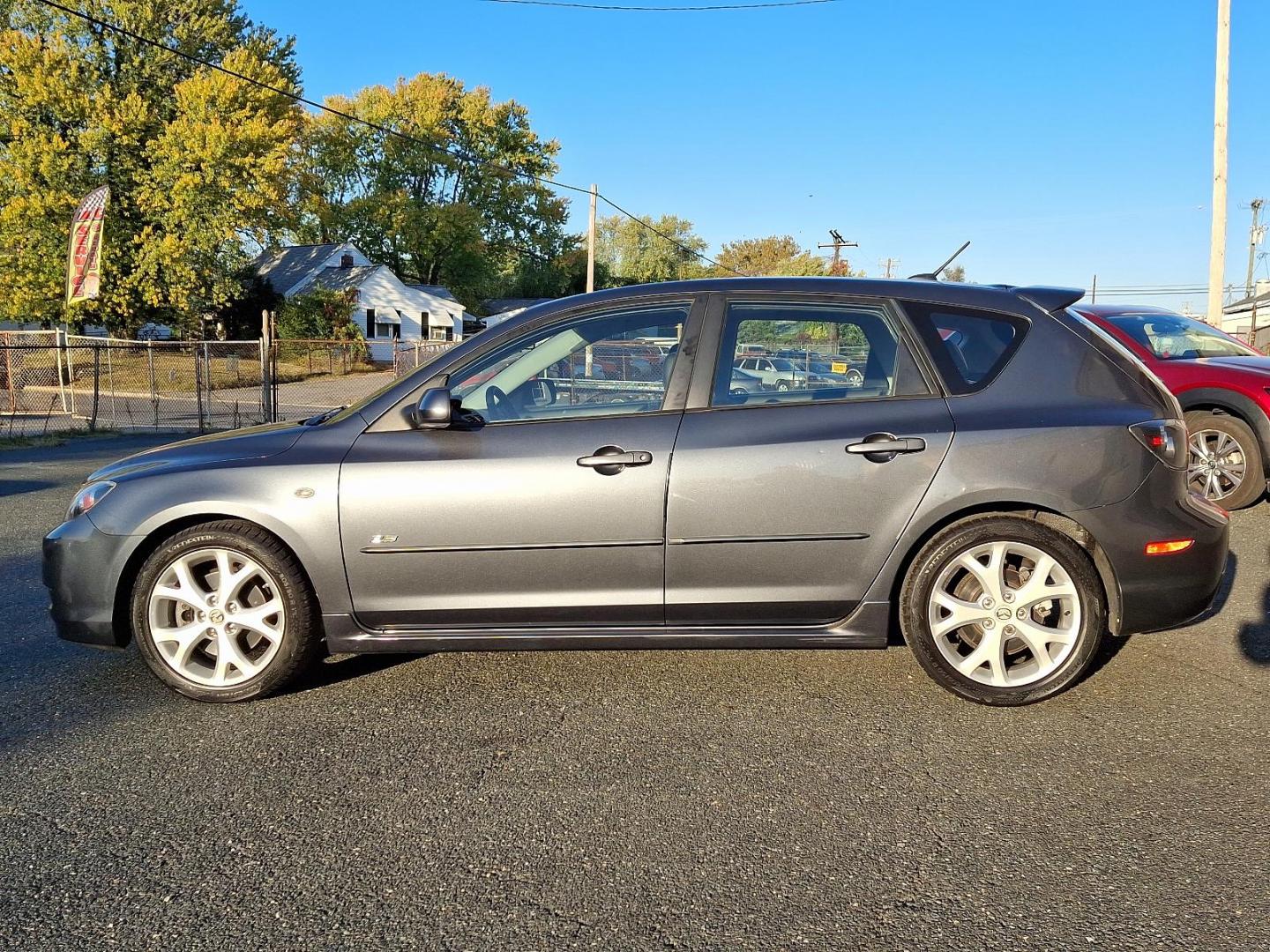 2009 Metropolitan Gray Mica - 36C /Black - BR6 Mazda MAZDA3 s Grand Touring (JM1BK343191) with an 2.3L DOHC MPFI 16-valve I4 engine w/variable valve timing (VVT), balance shafts engine, located at 50 Eastern Blvd., Essex, MD, 21221, (410) 686-3444, 39.304367, -76.484947 - Feast your eyes on this well-maintained 2009 Mazda MAZDA3 s Grand Touring, an epitome of design and functionality. This 5-door hatchback comes with an elegant metropolitan gray mica exterior complemented by a plush black interior. Under the hood, it boasts a powerful, sophisticated 2.3L DOHC MPFI 16 - Photo#6