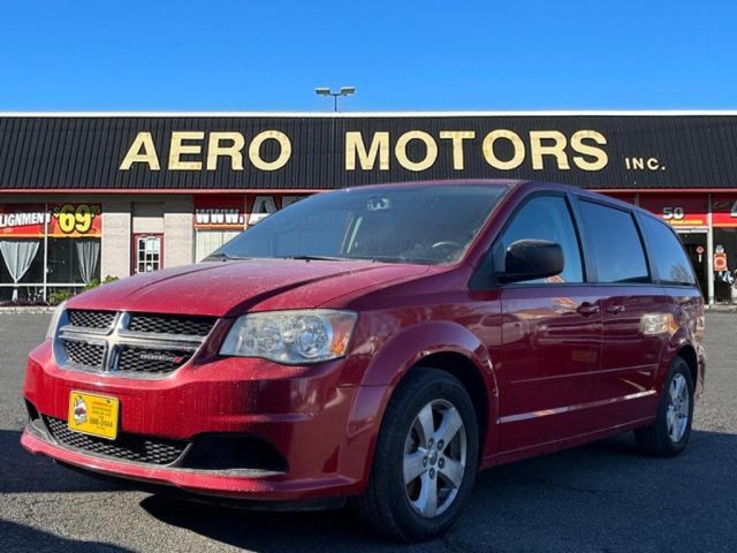 2013 Red Dodge Grand Caravan SE (2C4RDGBG3DR) with an 3.6L Pentastar 3.6L V6 283hp 260ft. lbs. Sequential-Port F.I. engine, 6-Speed Shiftable Automatic transmission, located at 50 Eastern Blvd., Essex, MD, 21221, (410) 686-3444, 39.304367, -76.484947 - Photo#0