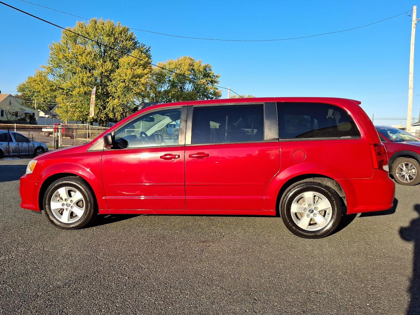 2013 Red Dodge Grand Caravan SE (2C4RDGBG3DR) with an 3.6L Pentastar 3.6L V6 283hp 260ft. lbs. Sequential-Port F.I. engine, 6-Speed Shiftable Automatic transmission, located at 50 Eastern Blvd., Essex, MD, 21221, (410) 686-3444, 39.304367, -76.484947 - Photo#30