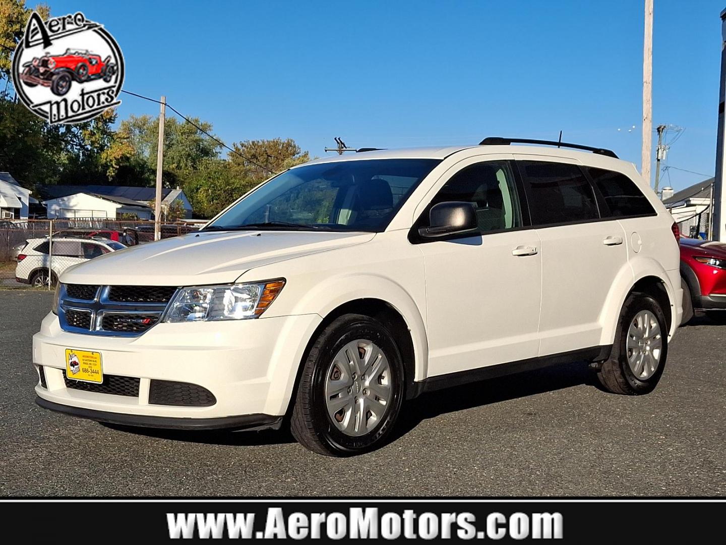 2018 Vice White - PW3 /Black - E5X9 Dodge Journey SE (3C4PDCAB7JT) with an ENGINE: 2.4L I4 DOHC 16V DUAL VVT engine, located at 50 Eastern Blvd., Essex, MD, 21221, (410) 686-3444, 39.304367, -76.484947 - Feast your eyes on the stunning 2018 Dodge Journey SE in a striking Vice White exterior, enhanced by a sleek black interior. This front-wheel-drive vehicle is powered by a robust 2.4L I4 DOHC 16V Dual VVT engine, promising an impressive performance on the road. The Journey SE embodies refined mechan - Photo#0