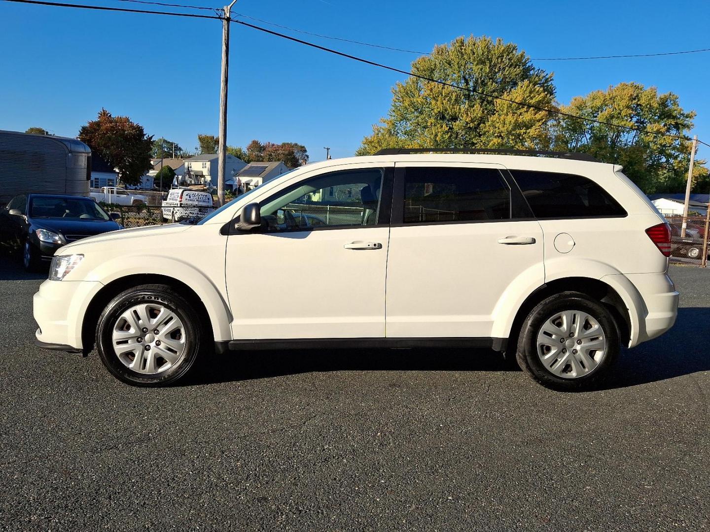 2018 Vice White - PW3 /Black - E5X9 Dodge Journey SE (3C4PDCAB7JT) with an ENGINE: 2.4L I4 DOHC 16V DUAL VVT engine, located at 50 Eastern Blvd., Essex, MD, 21221, (410) 686-3444, 39.304367, -76.484947 - Feast your eyes on the stunning 2018 Dodge Journey SE in a striking Vice White exterior, enhanced by a sleek black interior. This front-wheel-drive vehicle is powered by a robust 2.4L I4 DOHC 16V Dual VVT engine, promising an impressive performance on the road. The Journey SE embodies refined mechan - Photo#6