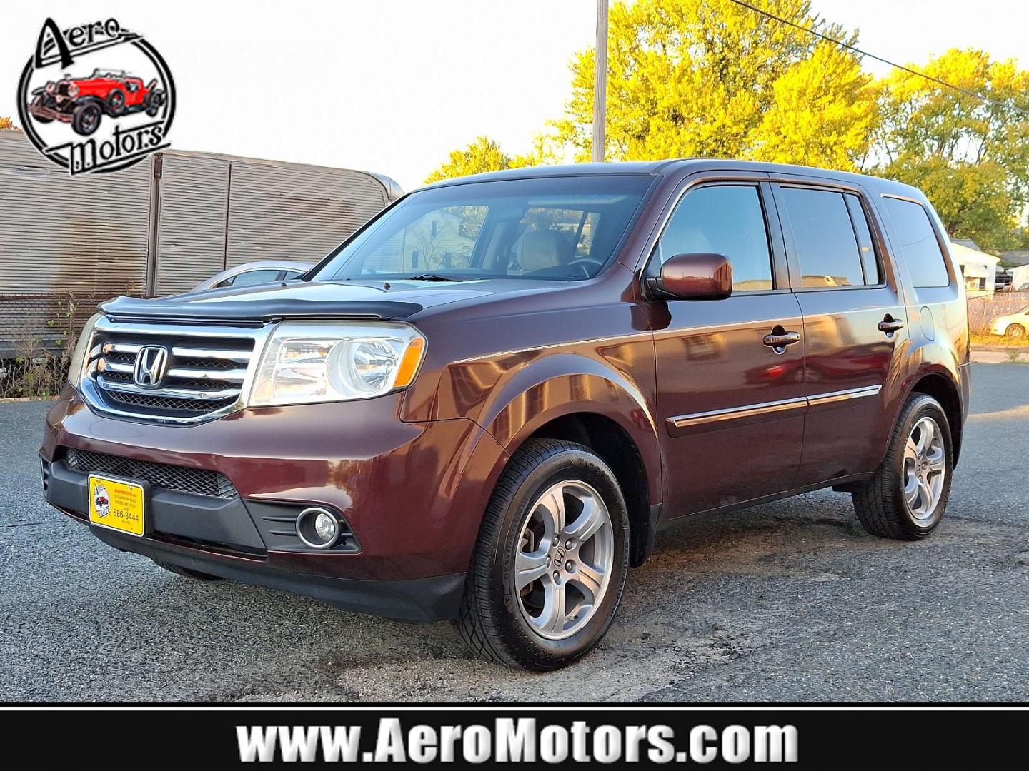 2012 Dark Cherry Pearl II - RX /Beige - BE Honda Pilot EX (5FNYF4H42CB) with an 3.5L SOHC MPFI 24-valve i-VTEC V6 engine engine, located at 50 Eastern Blvd., Essex, MD, 21221, (410) 686-3444, 39.304367, -76.484947 - Presenting a stunning 2012 Honda Pilot EX 4WD 4DR EX cloaked in a captivating maroon color for a unique style statement. This spectacular ride seats seven, ensuring comfort and space for family and friends. At its heart, the Pilot runs on a robust 3.5L SOHC MPFI 24-valve i-VTEC V6 engine, combining - Photo#0