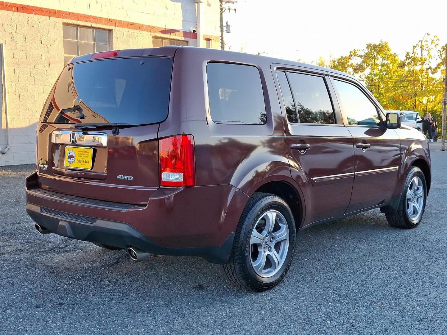 2012 Dark Cherry Pearl II - RX /Beige - BE Honda Pilot EX (5FNYF4H42CB) with an 3.5L SOHC MPFI 24-valve i-VTEC V6 engine engine, located at 50 Eastern Blvd., Essex, MD, 21221, (410) 686-3444, 39.304367, -76.484947 - Presenting a stunning 2012 Honda Pilot EX 4WD 4DR EX cloaked in a captivating maroon color for a unique style statement. This spectacular ride seats seven, ensuring comfort and space for family and friends. At its heart, the Pilot runs on a robust 3.5L SOHC MPFI 24-valve i-VTEC V6 engine, combining - Photo#3