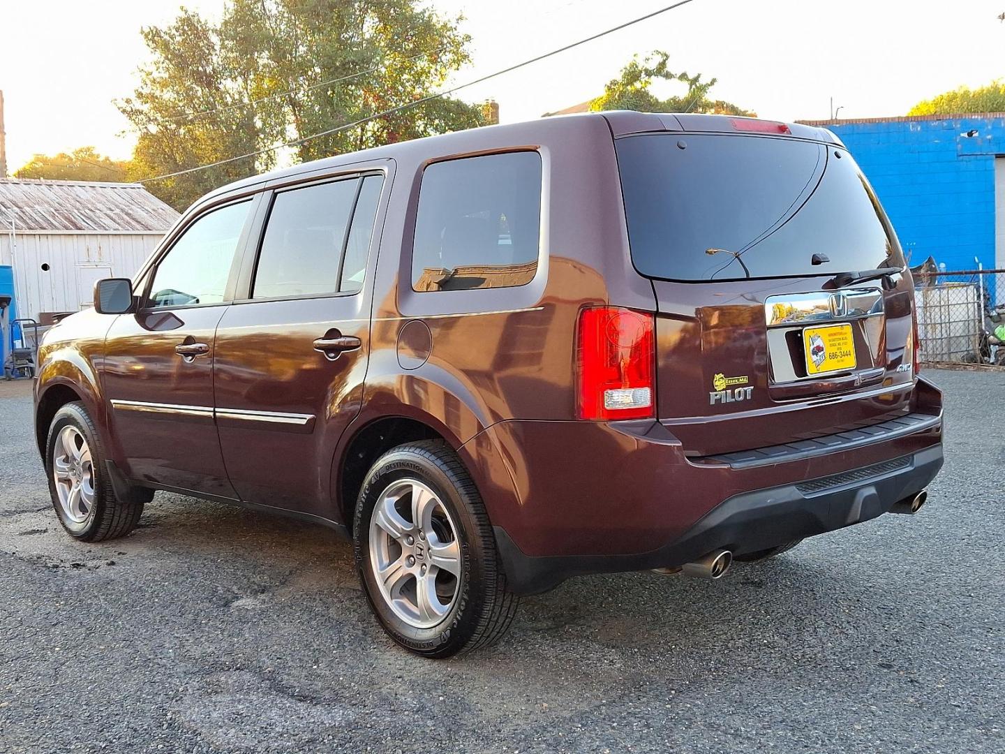 2012 Dark Cherry Pearl II - RX /Beige - BE Honda Pilot EX (5FNYF4H42CB) with an 3.5L SOHC MPFI 24-valve i-VTEC V6 engine engine, located at 50 Eastern Blvd., Essex, MD, 21221, (410) 686-3444, 39.304367, -76.484947 - Presenting a stunning 2012 Honda Pilot EX 4WD 4DR EX cloaked in a captivating maroon color for a unique style statement. This spectacular ride seats seven, ensuring comfort and space for family and friends. At its heart, the Pilot runs on a robust 3.5L SOHC MPFI 24-valve i-VTEC V6 engine, combining - Photo#5