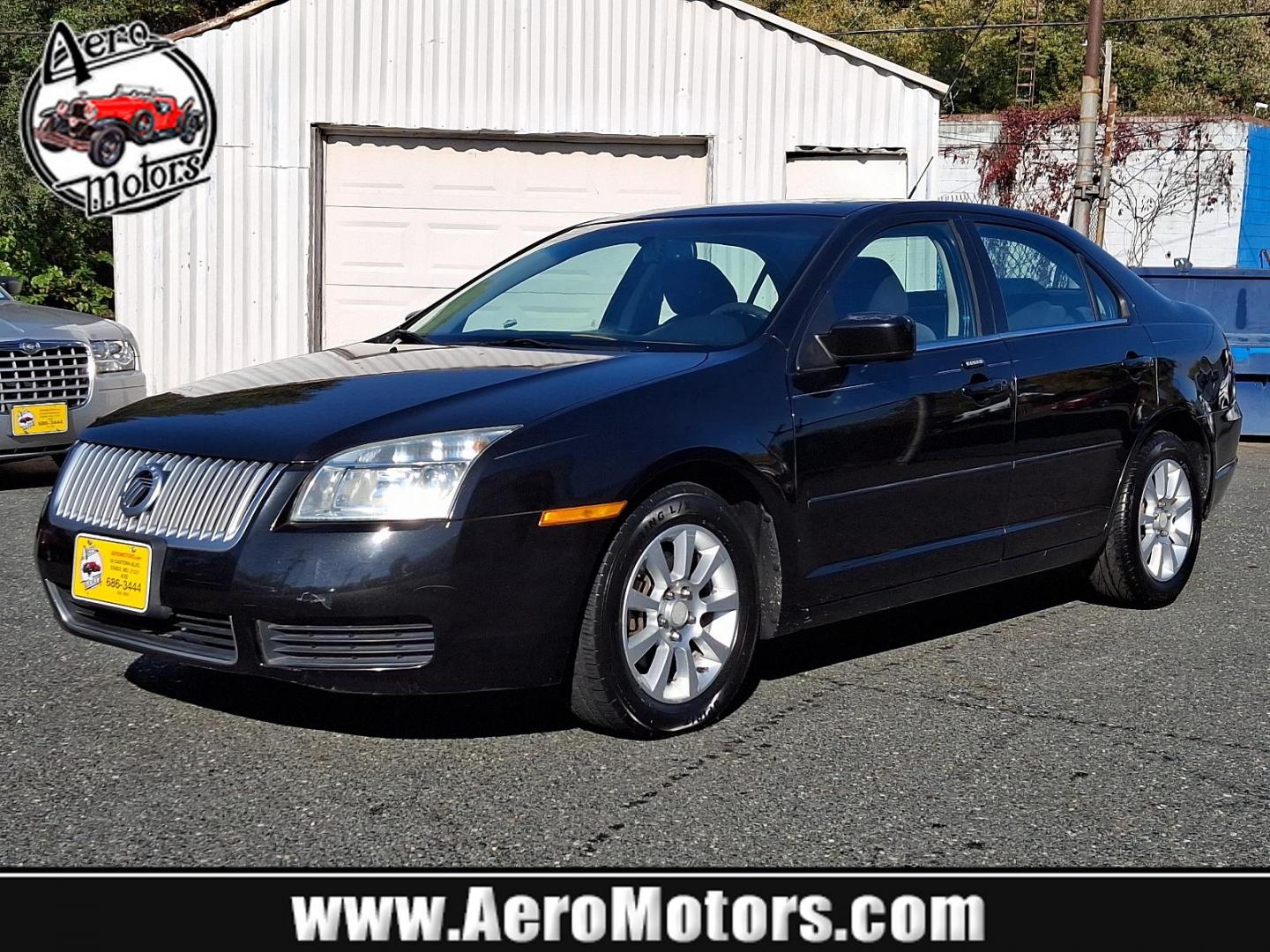 2009 Tuxedo Black Metallic - UH /Dark Charcoal - EW Mercury Milan (3MEHM07Z39R) with an 2.3L DOHC DURATEC I4 ENGINE engine, located at 50 Eastern Blvd., Essex, MD, 21221, (410) 686-3444, 39.304367, -76.484947 - Experience the right balance of style and performance with this 2009 Mercury Milan 4dr Sdn I4 FWD. Sporting a sleek black exterior, this vehicle delivers a sharp, commanding presence on the road. The heart of this Milan is its 2.3L DOHC Duratec I4 engine, designed for optimal performance and efficie - Photo#0