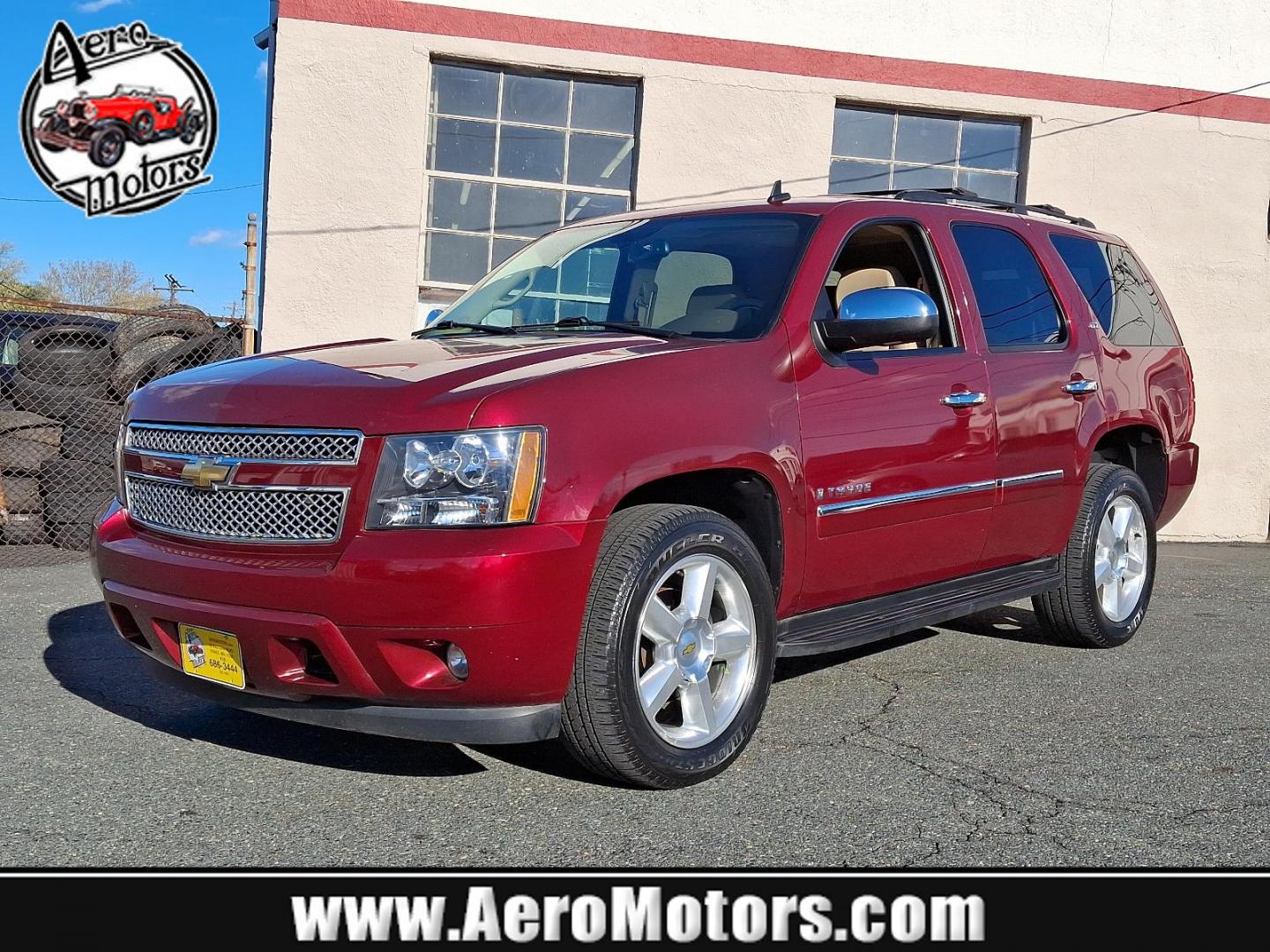 2009 Red Jewel Tintcoat - 80U /Light Cashmere/Dark Cashmere - 336 Chevrolet Tahoe LTZ (1GNFK33009J) with an ENGINE, VORTEC 5.3L V8 SFI FLEXFUEL engine, located at 50 Eastern Blvd., Essex, MD, 21221, (410) 686-3444, 39.304367, -76.484947 - Presenting an exquisite 2009 Chevrolet Tahoe LTZ 4WD 4dr 1500 LTZ that combines strength and style. Dressed in a sumptuous Red Jewel Tintcoat exterior paired with a tasteful Light Cashmere/Dark Cashmere interior, this SUV is a sight to behold. Under the hood, it boasts a powerful Vortec 5.3L V8 SFI - Photo#0