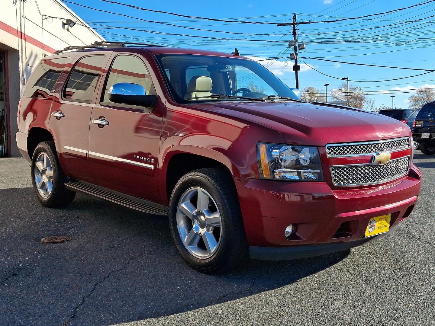 2009 Red Jewel Tintcoat - 80U /Light Cashmere/Dark Cashmere - 336 Chevrolet Tahoe LTZ (1GNFK33009J) with an ENGINE, VORTEC 5.3L V8 SFI FLEXFUEL engine, located at 50 Eastern Blvd., Essex, MD, 21221, (410) 686-3444, 39.304367, -76.484947 - Presenting an exquisite 2009 Chevrolet Tahoe LTZ 4WD 4dr 1500 LTZ that combines strength and style. Dressed in a sumptuous Red Jewel Tintcoat exterior paired with a tasteful Light Cashmere/Dark Cashmere interior, this SUV is a sight to behold. Under the hood, it boasts a powerful Vortec 5.3L V8 SFI - Photo#2