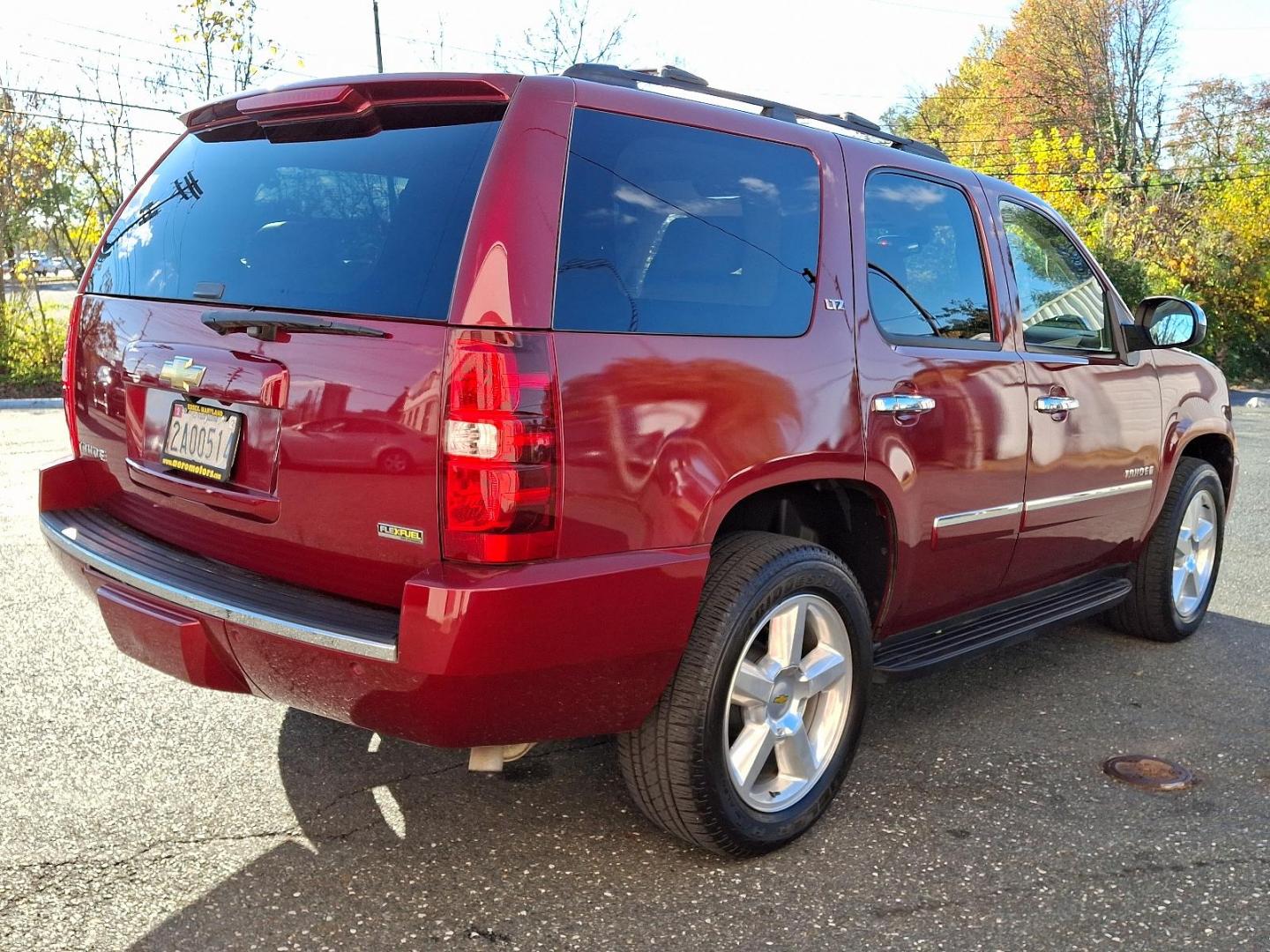 2009 Red Jewel Tintcoat - 80U /Light Cashmere/Dark Cashmere - 336 Chevrolet Tahoe LTZ (1GNFK33009J) with an ENGINE, VORTEC 5.3L V8 SFI FLEXFUEL engine, located at 50 Eastern Blvd., Essex, MD, 21221, (410) 686-3444, 39.304367, -76.484947 - Presenting an exquisite 2009 Chevrolet Tahoe LTZ 4WD 4dr 1500 LTZ that combines strength and style. Dressed in a sumptuous Red Jewel Tintcoat exterior paired with a tasteful Light Cashmere/Dark Cashmere interior, this SUV is a sight to behold. Under the hood, it boasts a powerful Vortec 5.3L V8 SFI - Photo#3